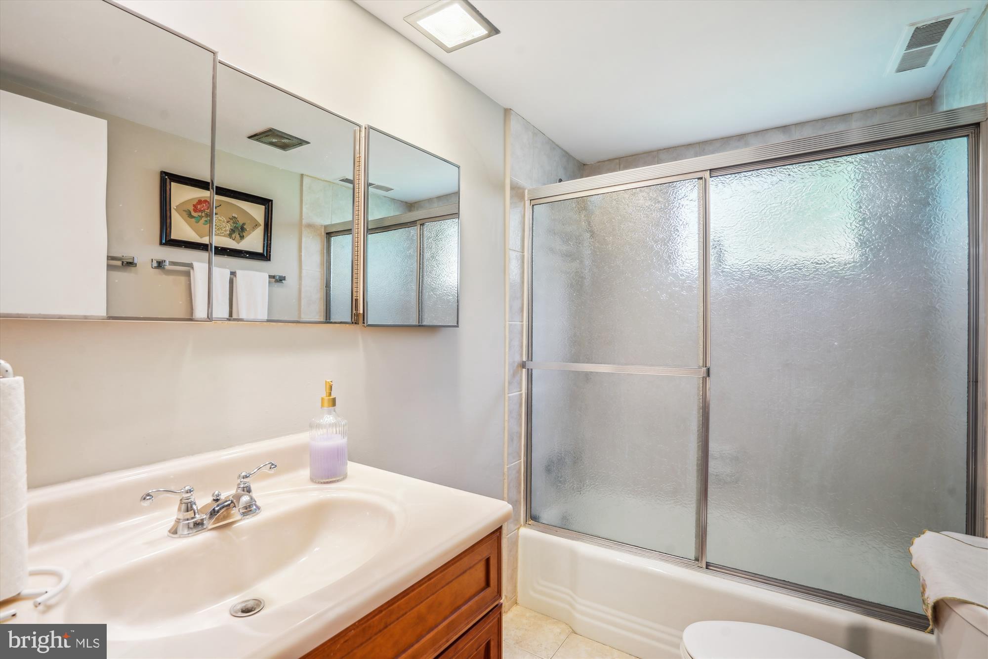 1803 Rupert Street McLean, VA 22101 - Photo 11 of 20 a bathroom with a sink and a mirror
