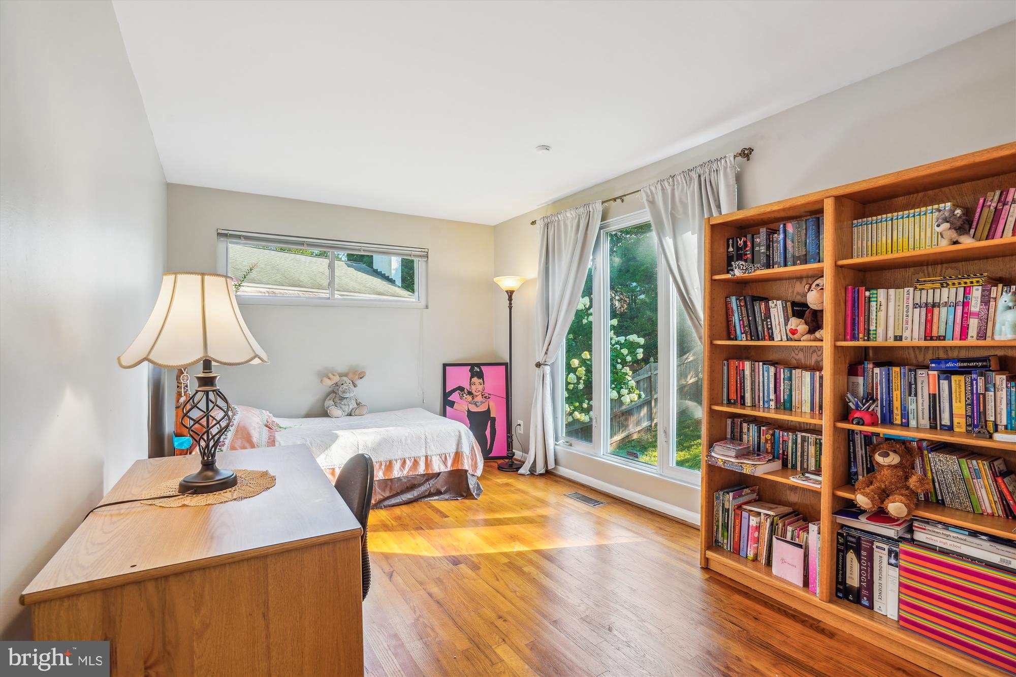 1803 Rupert Street McLean, VA 22101 - Photo 13 of 20 a bedroom with furniture and a book shelf
