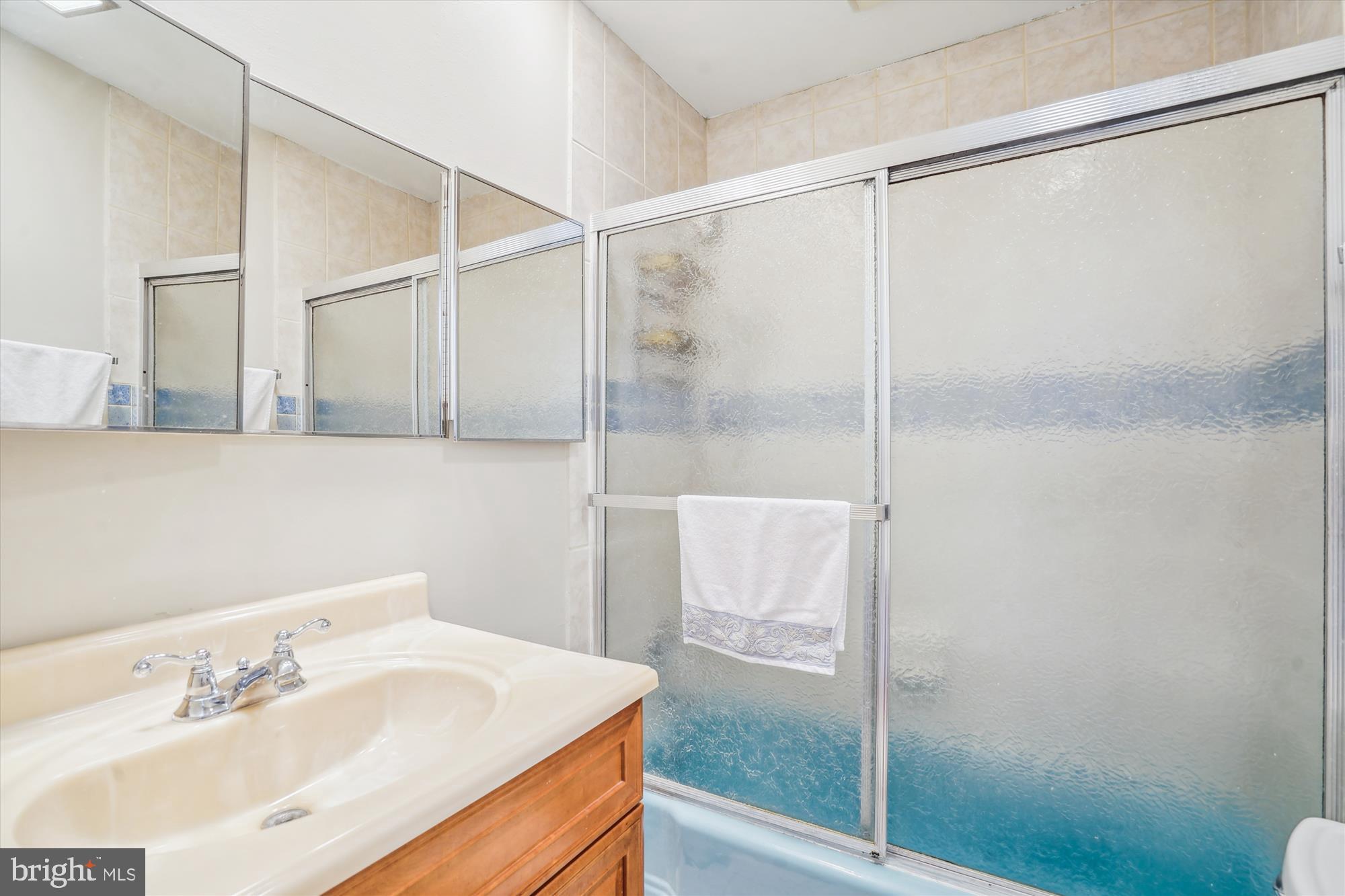 1803 Rupert Street McLean, VA 22101 - Photo 18 of 20 a bathroom with a sink and a mirror