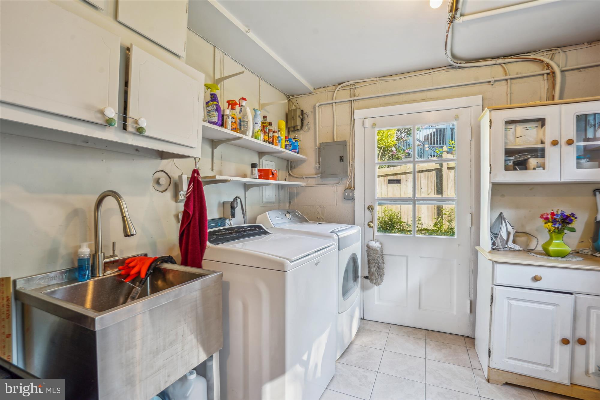 1803 Rupert Street McLean, VA 22101 - Photo 19 of 20 a utility room with cabinets washer and dryer