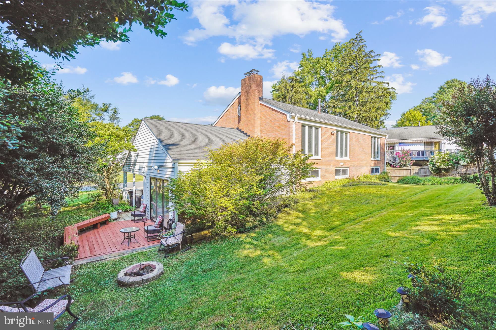 1803 Rupert Street McLean, VA 22101 - Photo 2 of 20 a backyard of a house with table and chairs