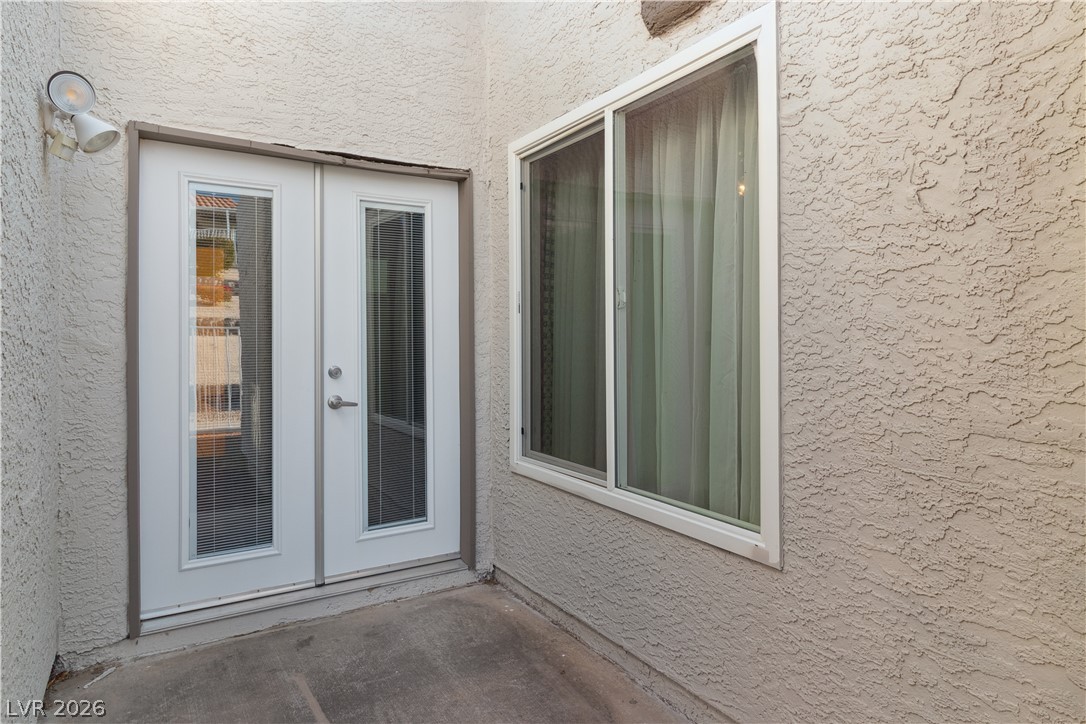 2146 High Dunes Lane Laughlin, NV 89029 - Photo 43 of 64 Entrance to Primary Bedroom featuring french doors and stucco siding