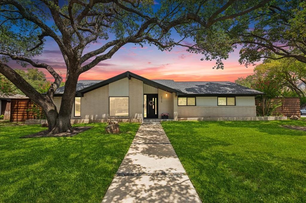 4925 Sugar Mill Road Dallas, TX 75244 - Photo 1 of 22 a front view of a house with yard