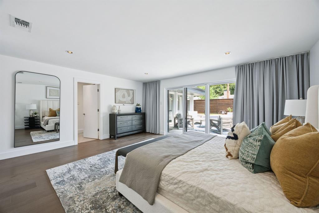 4925 Sugar Mill Road Dallas, TX 75244 - Photo 15 of 22 a bedroom with bed and glass door