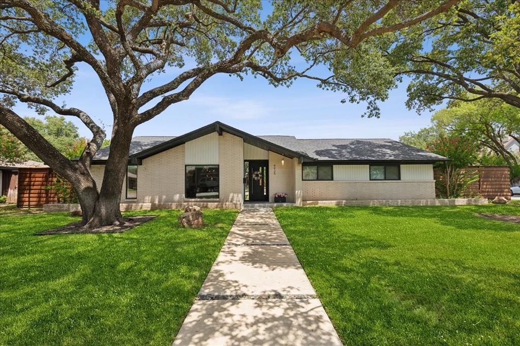 4925 Sugar Mill Road Dallas, TX 75244 - Photo 2 of 22 a front view of a house with yard