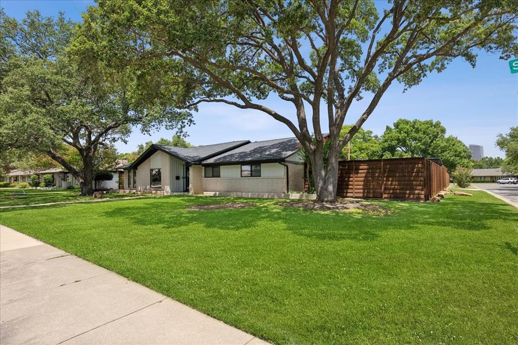 4925 Sugar Mill Road Dallas, TX 75244 - Photo 22 of 22 a front view of a house with a garden