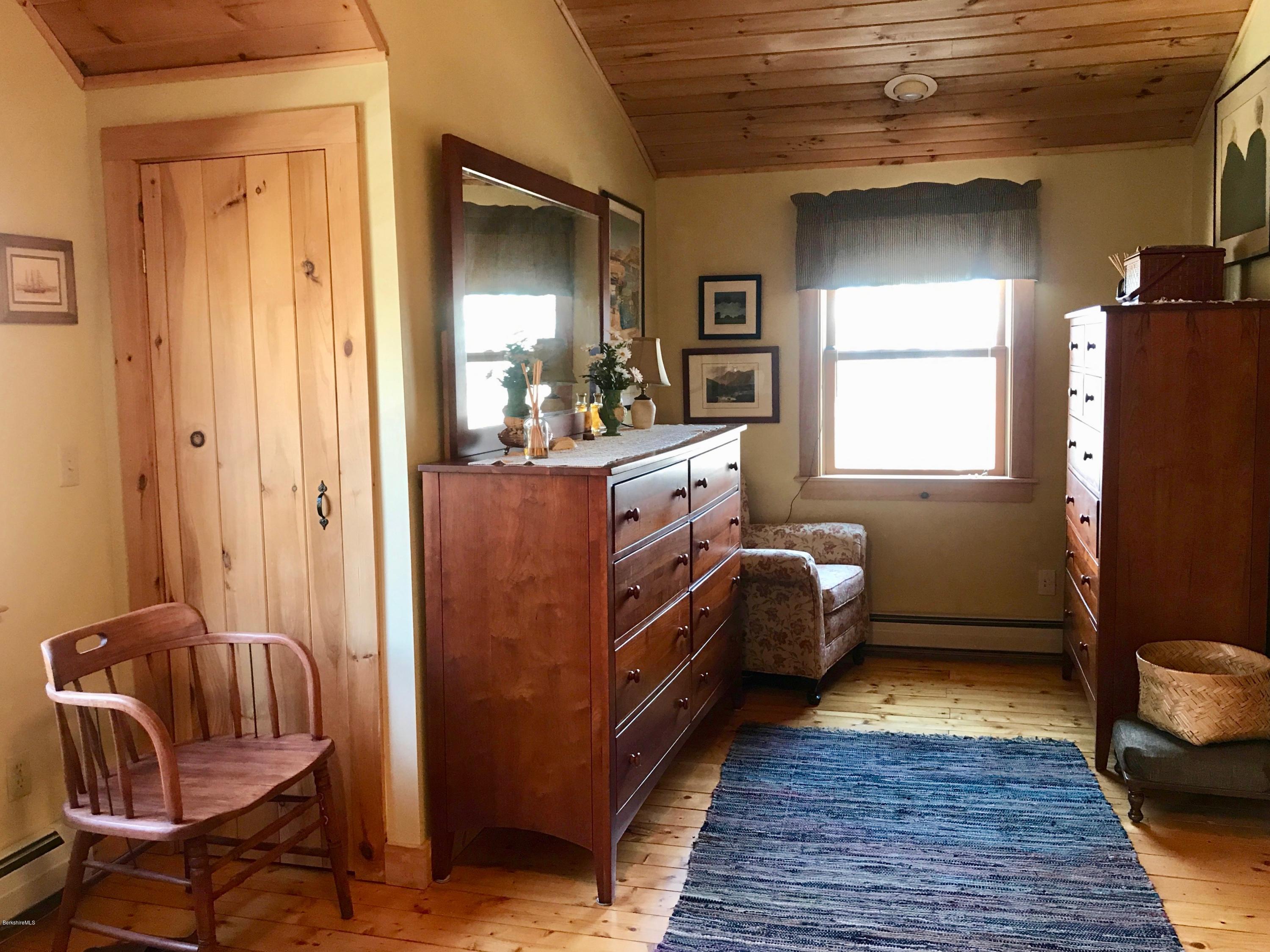 128 Branch Hill Road Heath, MA 01346 - Photo 12 of 30 a bedroom with a bed and wooden floor