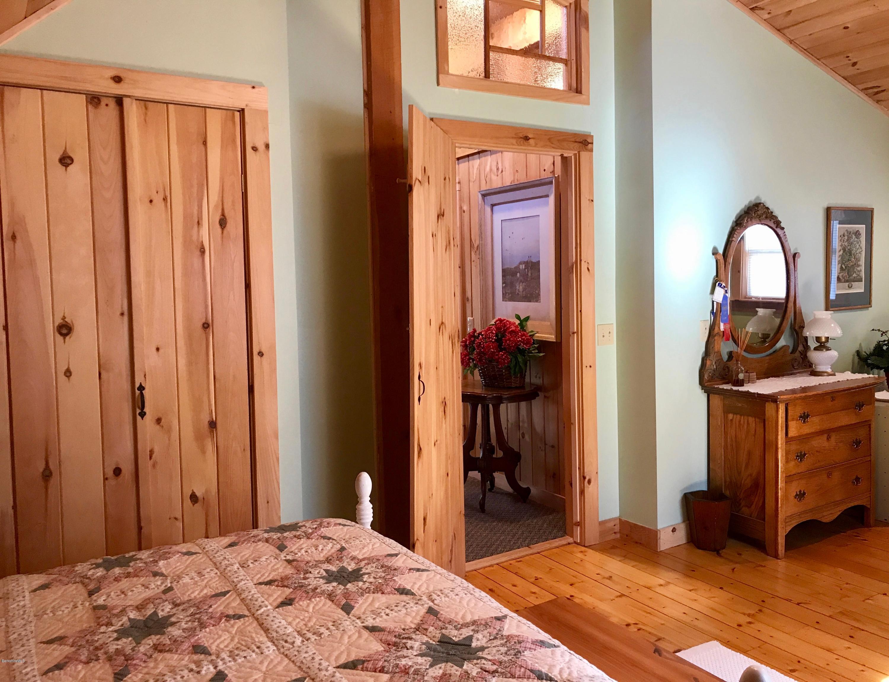 128 Branch Hill Road Heath, MA 01346 - Photo 16 of 30 a bedroom with a bed and a dresser
