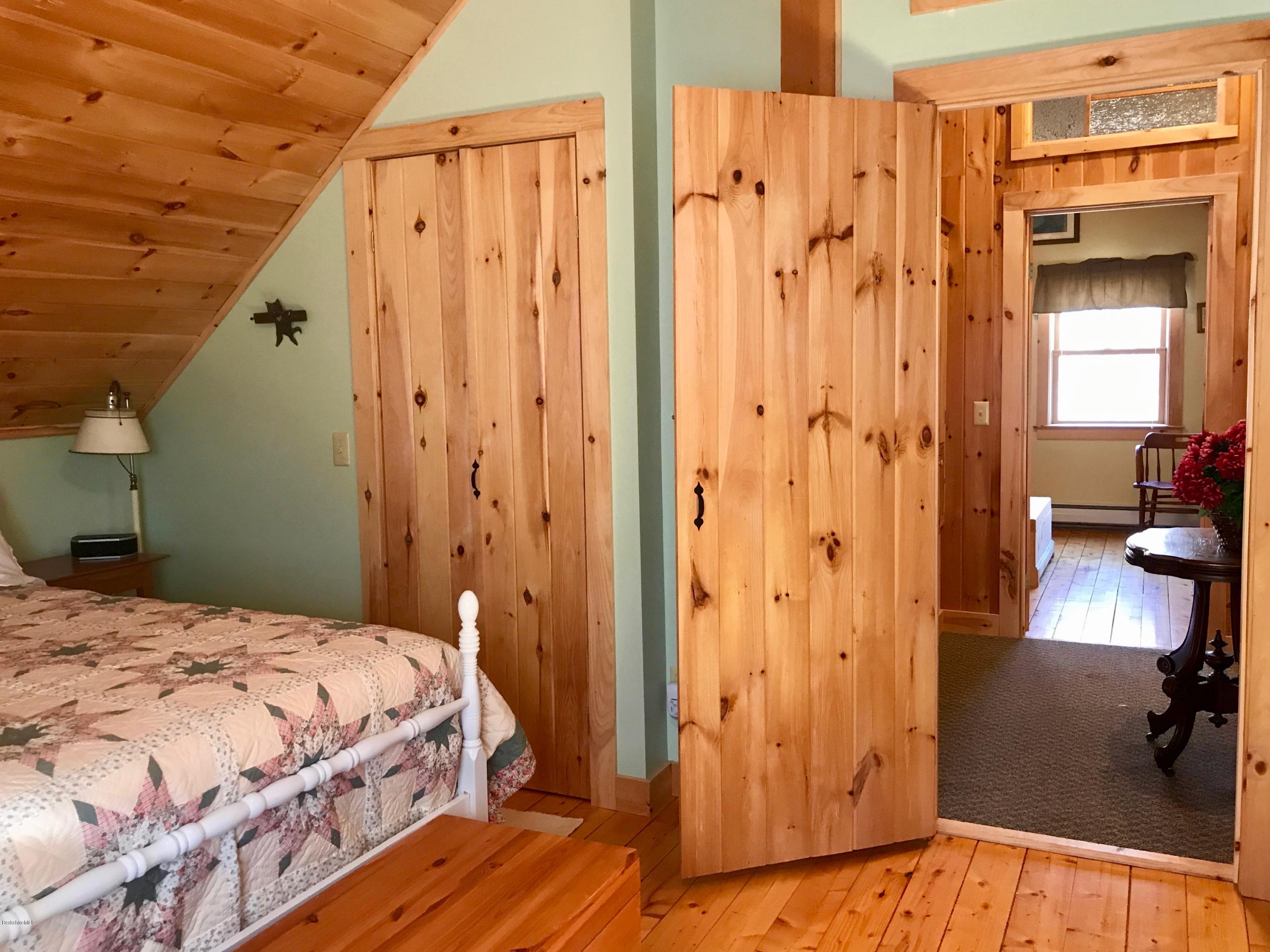 128 Branch Hill Road Heath, MA 01346 - Photo 17 of 30 a bedroom with a bed and a mirror