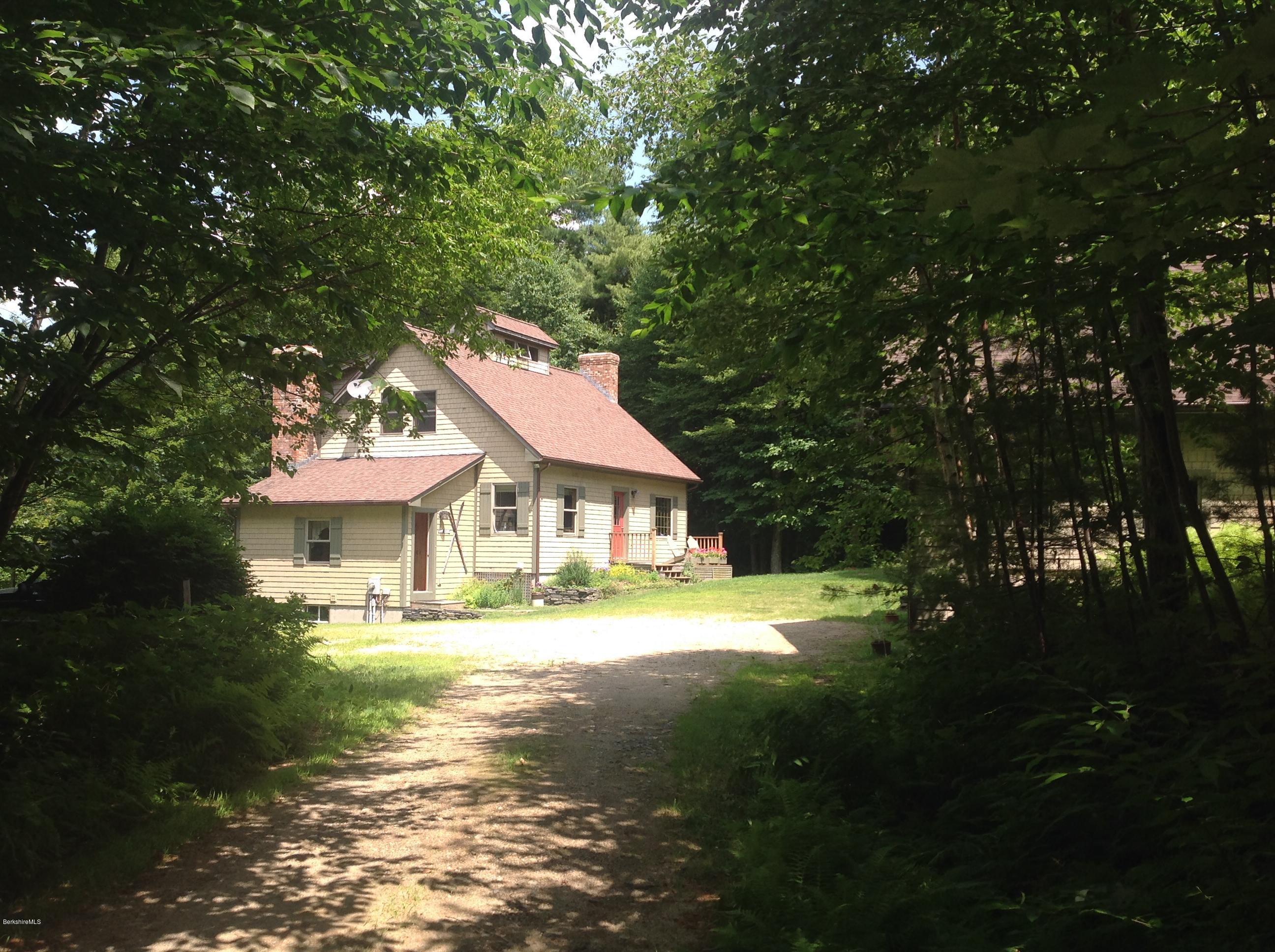 128 Branch Hill Road Heath, MA 01346 - Photo 3 of 30 a front view of a house with a garden