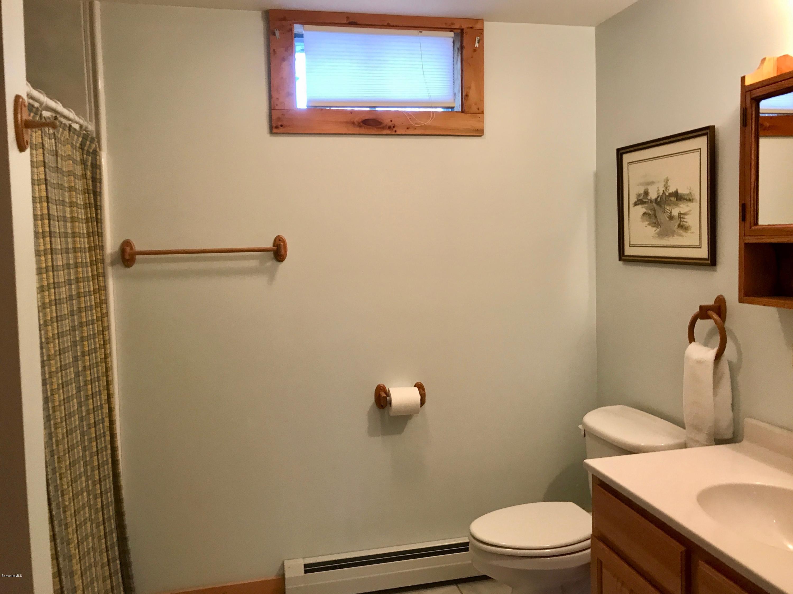 128 Branch Hill Road Heath, MA 01346 - Photo 22 of 30 a white toilet sitting next to a bathroom sink