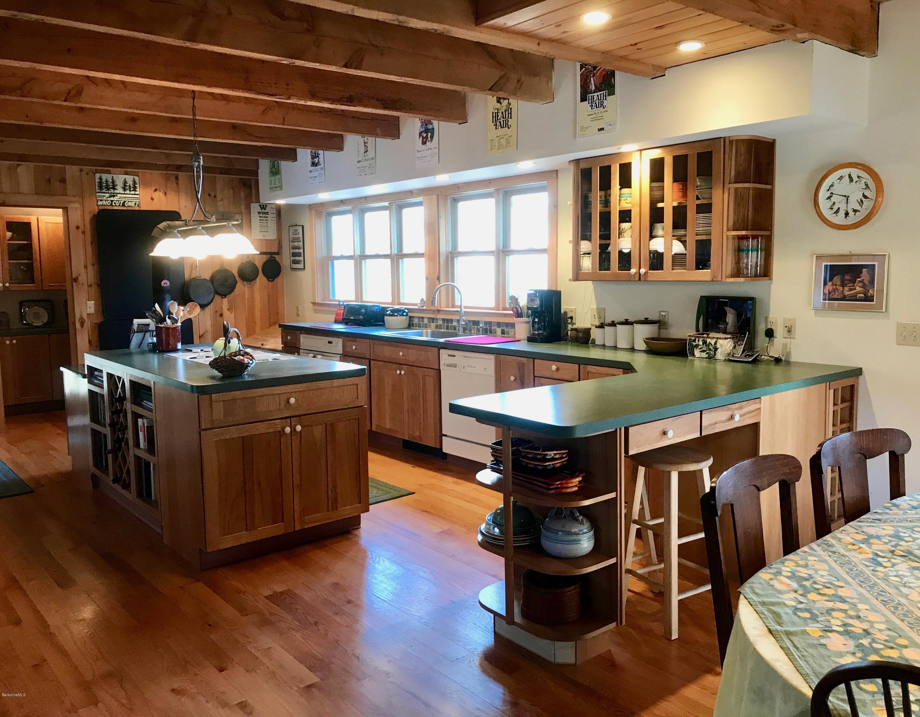 128 Branch Hill Road Heath, MA 01346 - Photo 6 of 30 a kitchen with a stove dining table and chairs