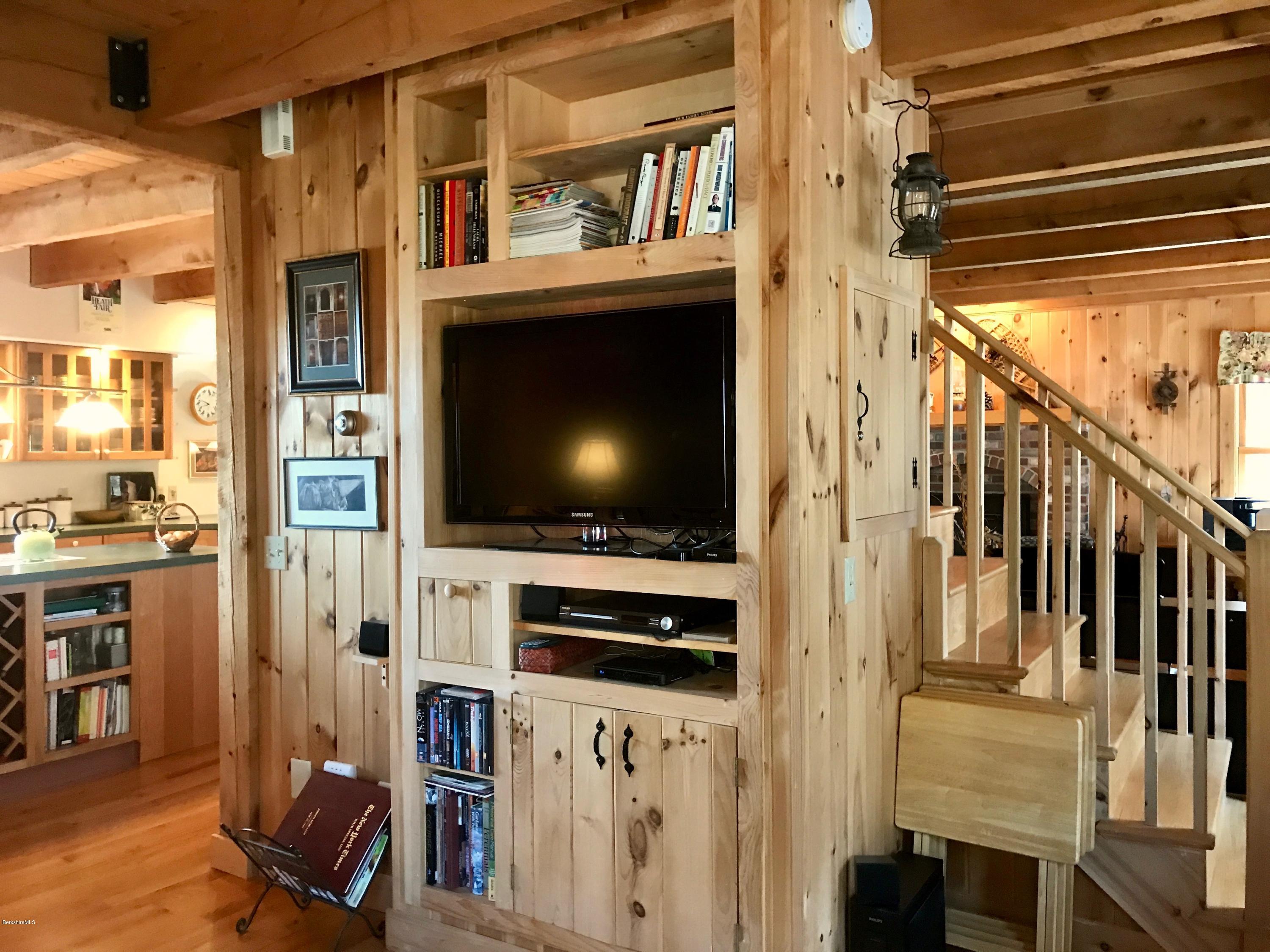 128 Branch Hill Road Heath, MA 01346 - Photo 8 of 30 a living room with wooden floor and a flat screen tv