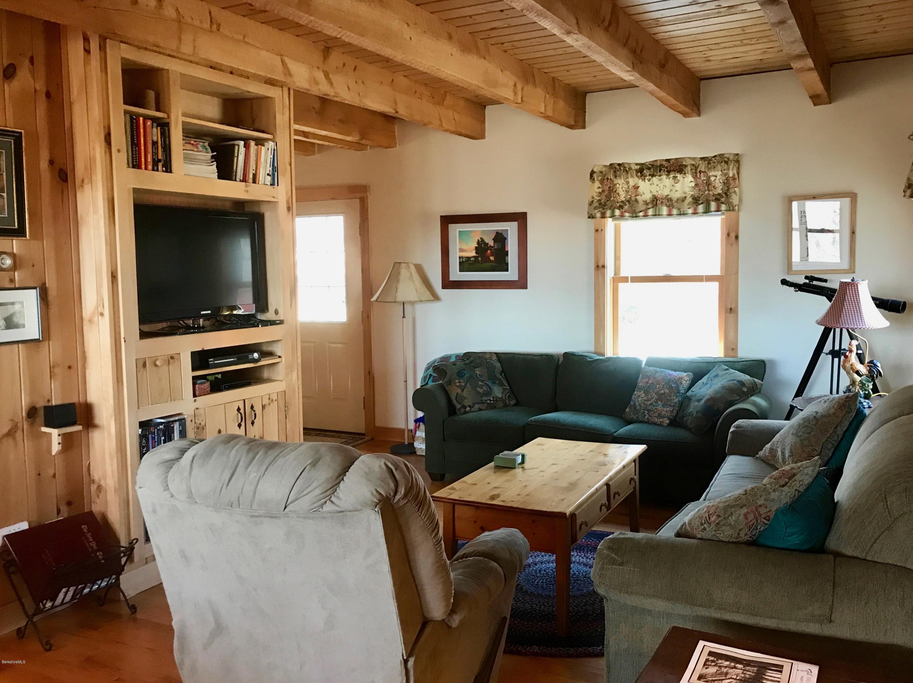 128 Branch Hill Road Heath, MA 01346 - Photo 9 of 30 a living room with furniture windows and a flat screen tv