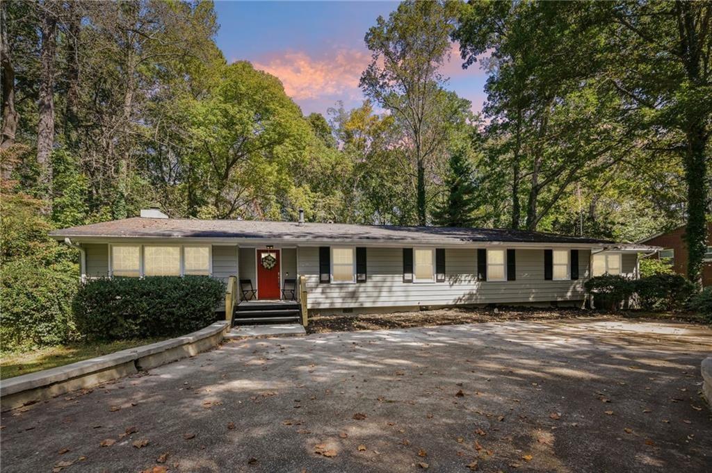 187 Old Timber Road Lawrenceville, GA 30046 - Photo 1 of 32 a front view of house with yard and trees around