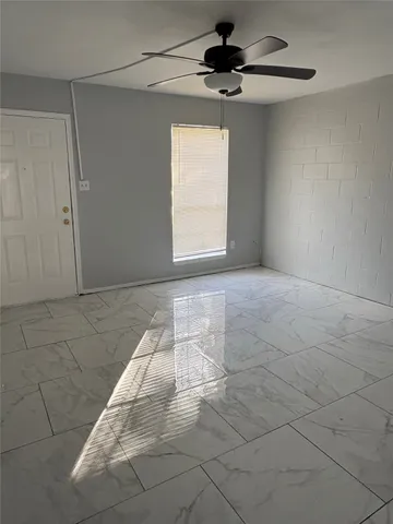 a view of an empty room and a window