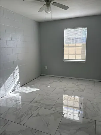 a view of an empty room and window