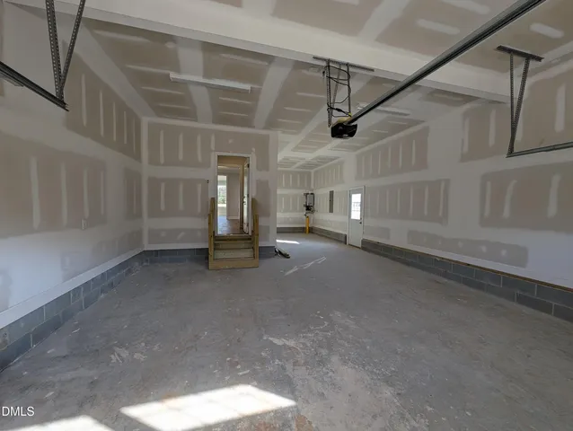 a spacious bathroom with a double vanity sink and a mirror