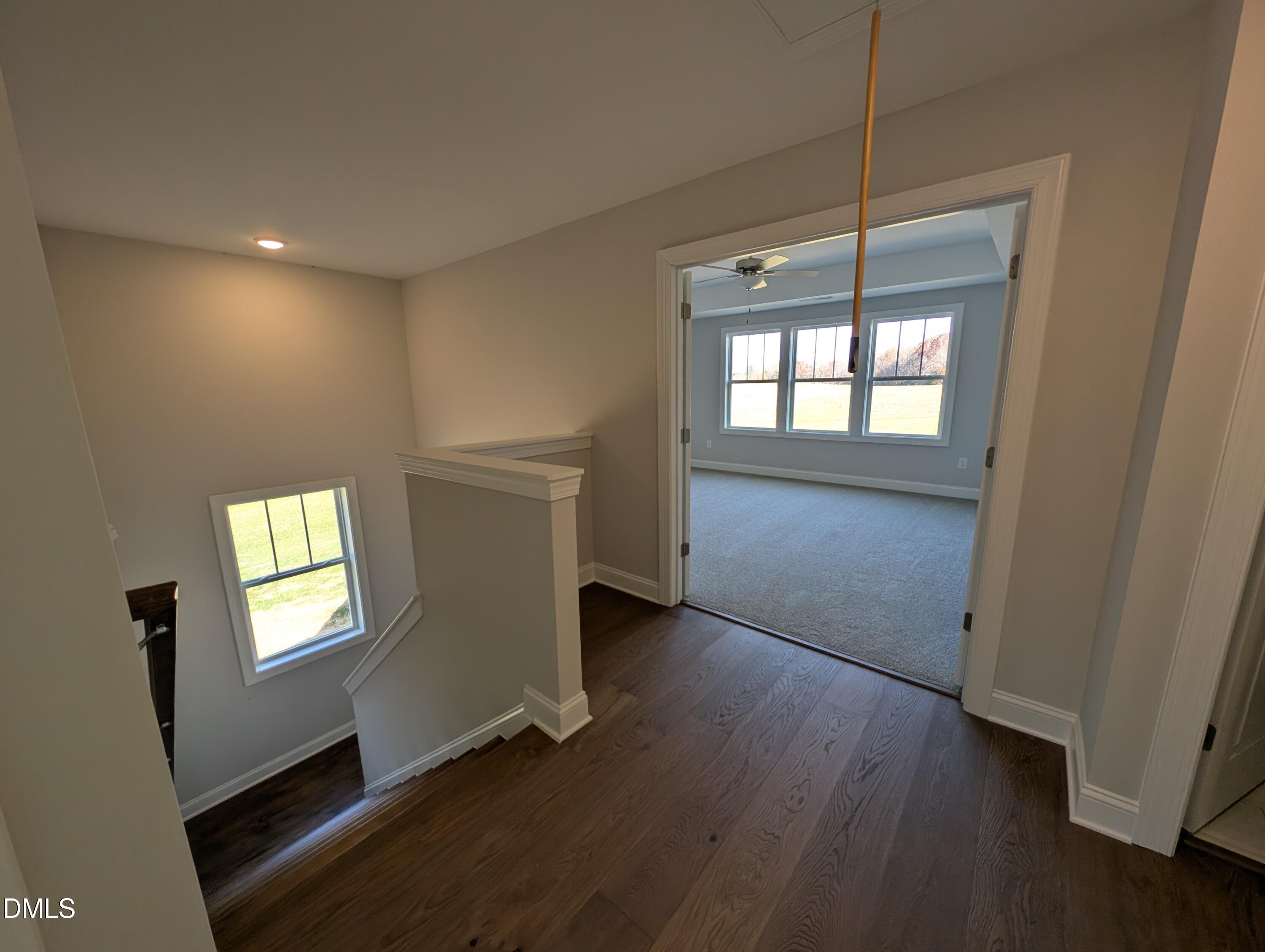 2818 John Lewis Road Burlington, NC 27217 - Photo 30 of 62 a view of an empty room with a window and wooden floor