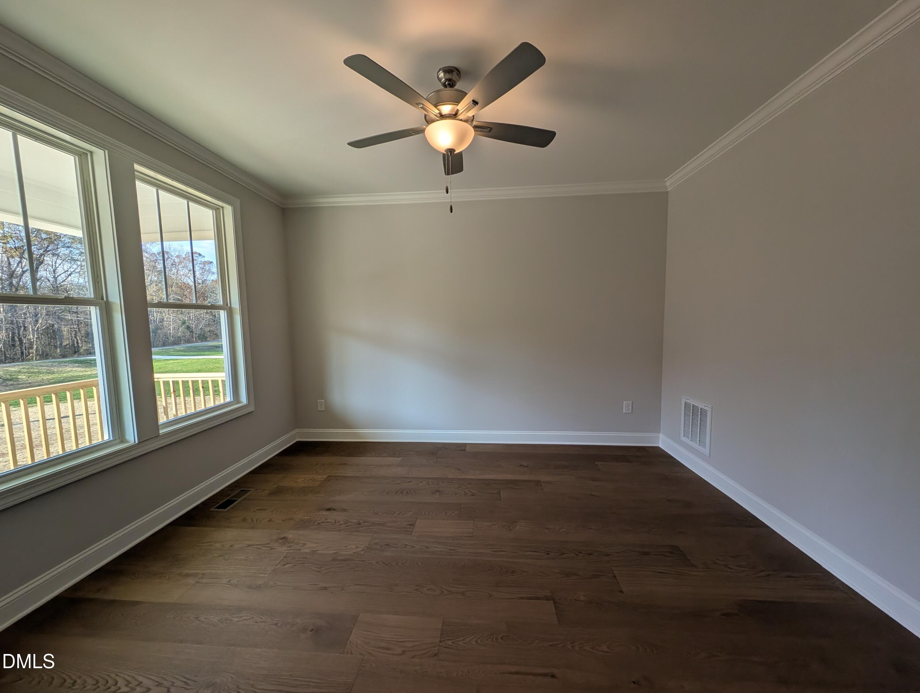 2818 John Lewis Road Burlington, NC 27217 - Photo 3 of 62 an empty room with wooden floor and windows