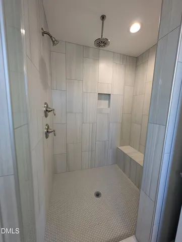 a view of a kitchen with white cabinets