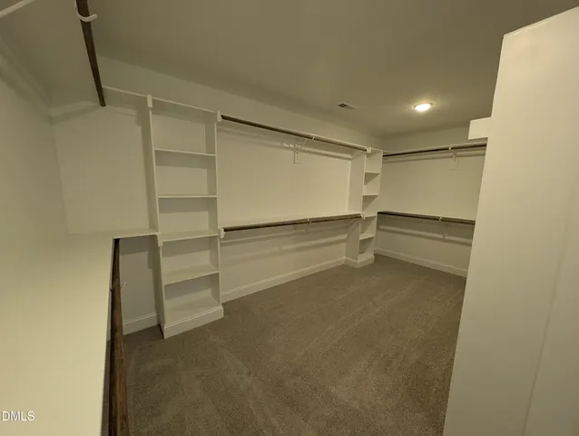 a view of a hallway with a wooden floor