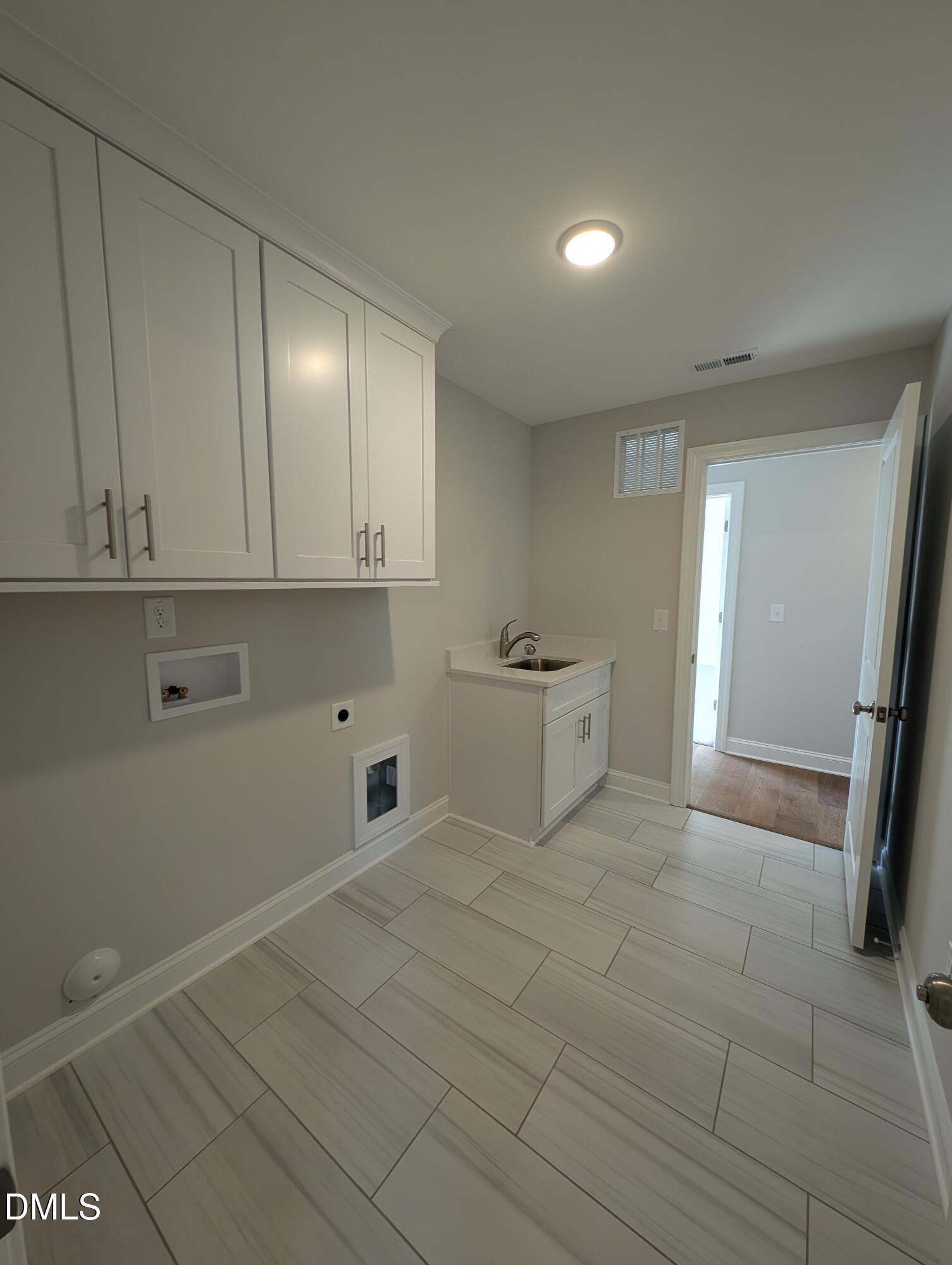 2818 John Lewis Road Burlington, NC 27217 - Photo 43 of 62 a view of a utility room with closet and mirror