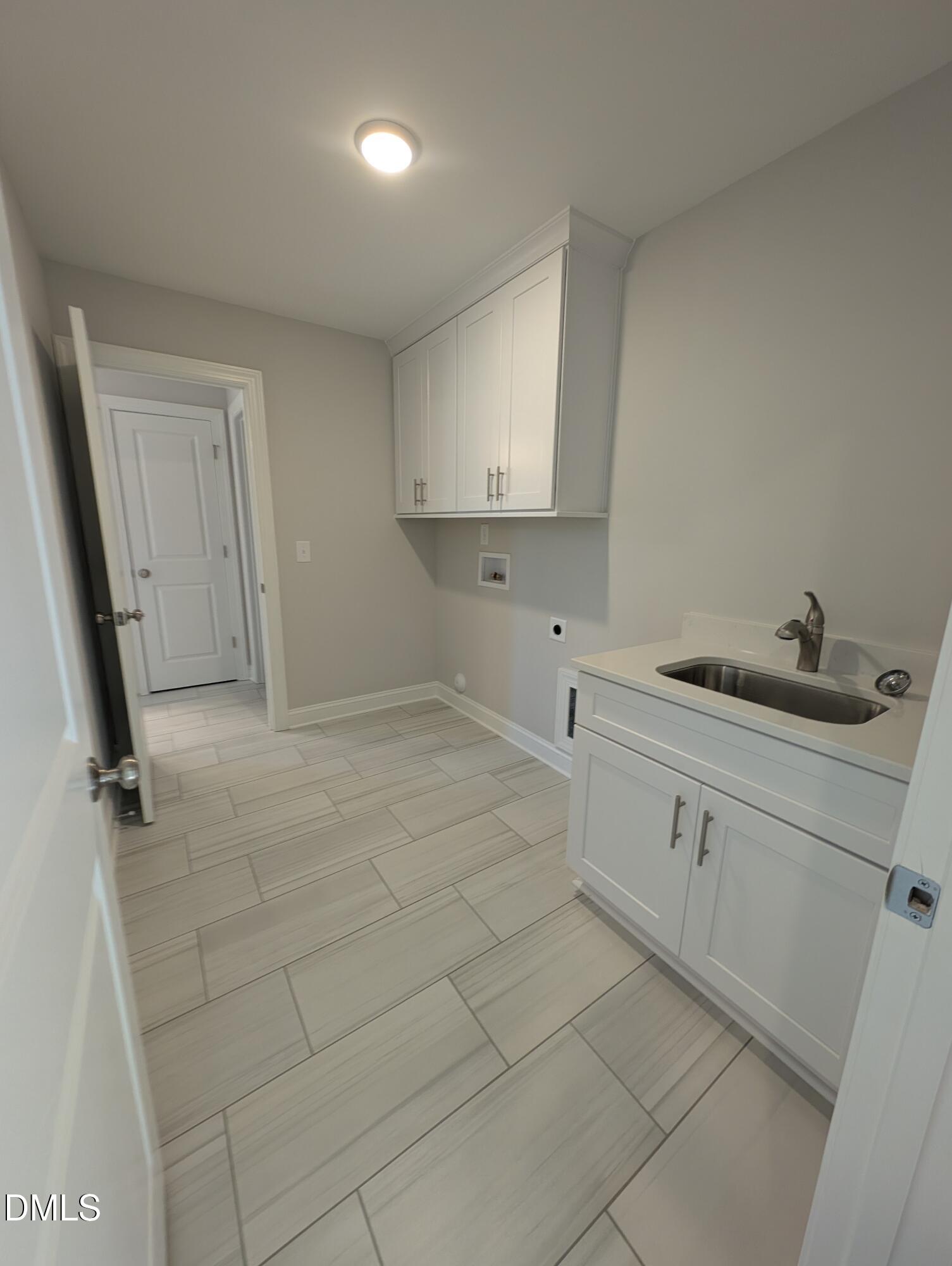 2818 John Lewis Road Burlington, NC 27217 - Photo 44 of 62 a view of a kitchen with white cabinets