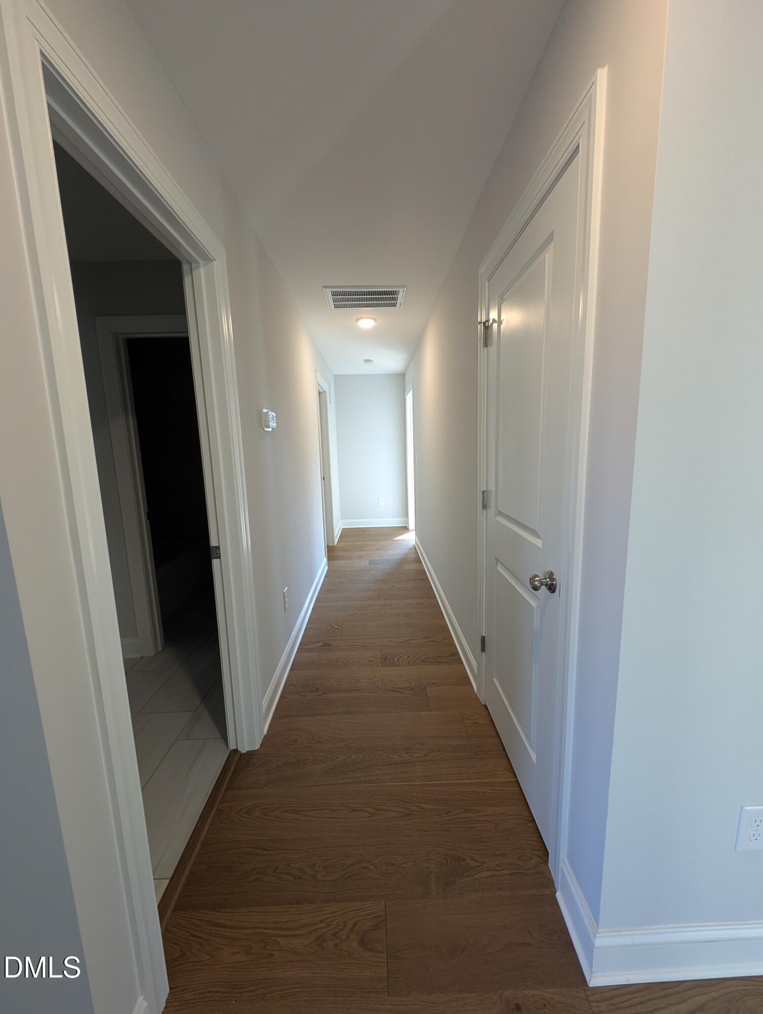 2818 John Lewis Road Burlington, NC 27217 - Photo 45 of 62 a view of a hallway with a wooden floor
