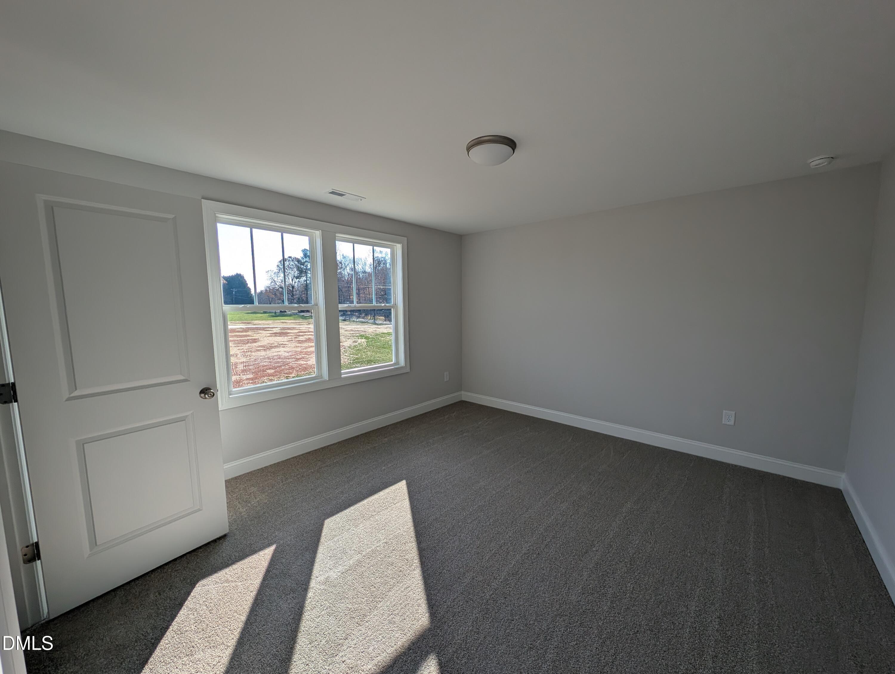 2818 John Lewis Road Burlington, NC 27217 - Photo 50 of 62 an empty room with windows