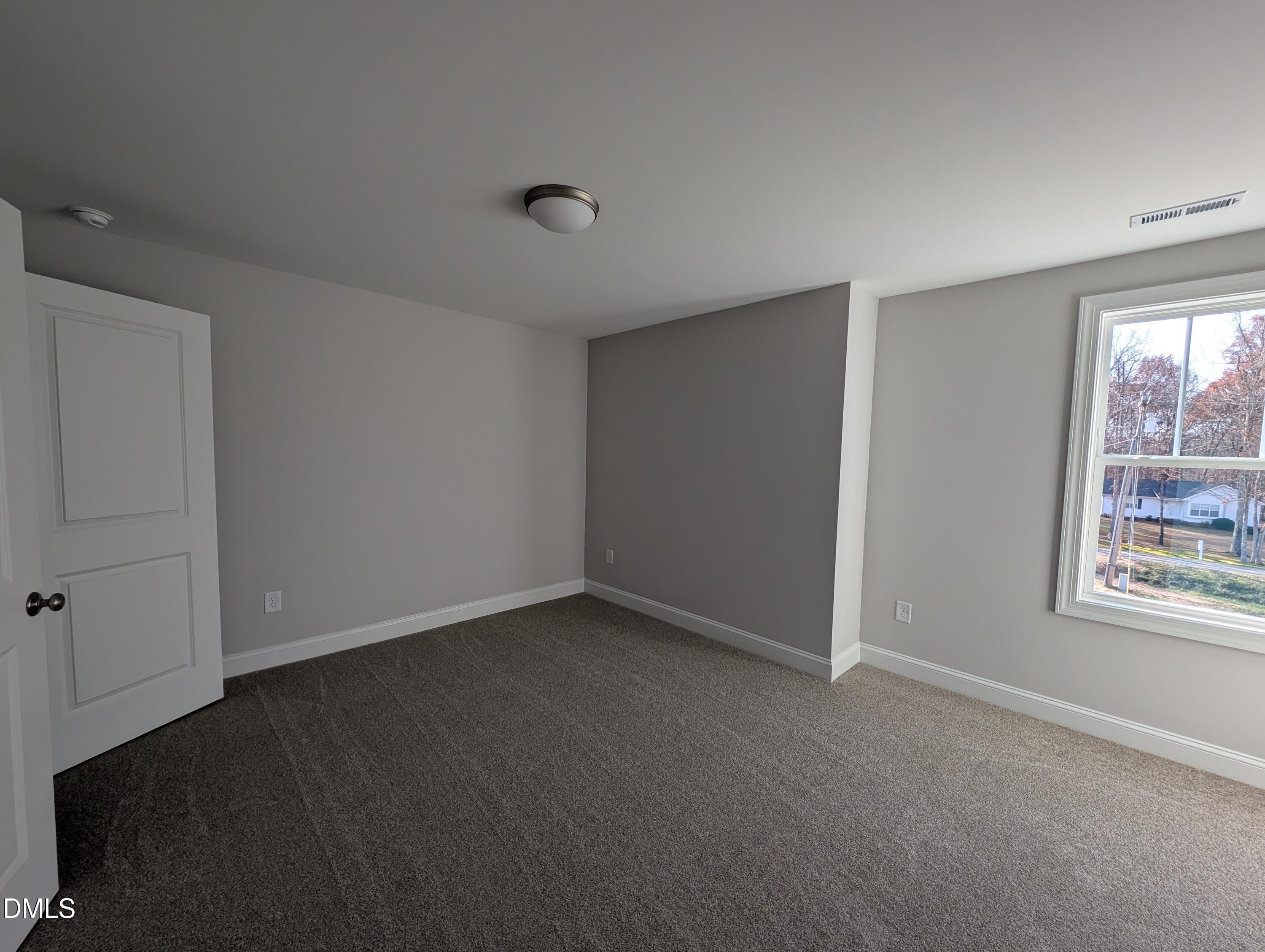 2818 John Lewis Road Burlington, NC 27217 - Photo 52 of 62 a view of an empty room with a window