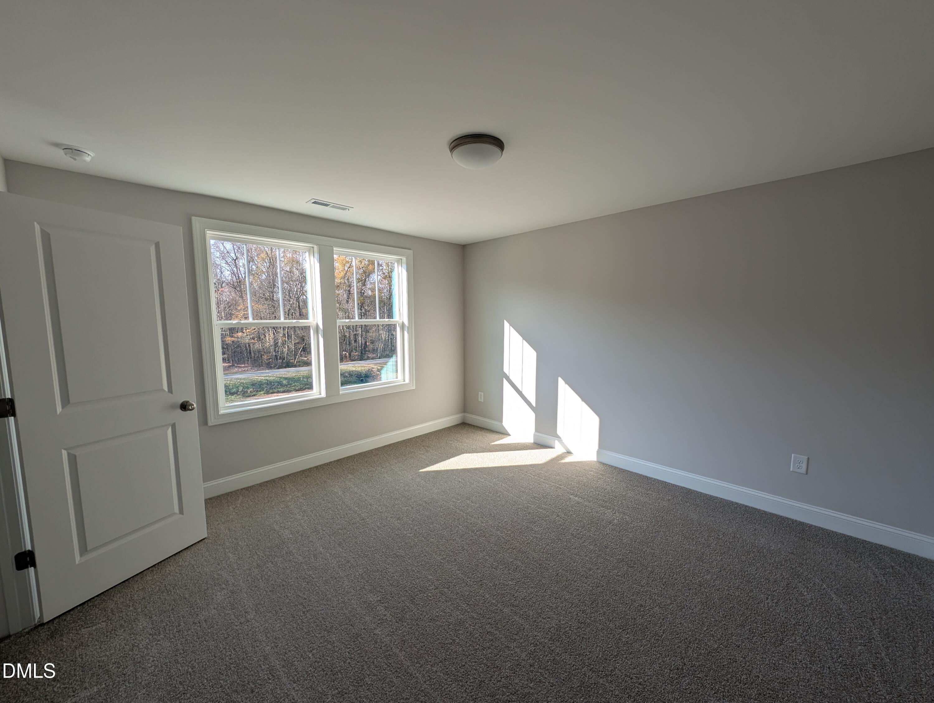2818 John Lewis Road Burlington, NC 27217 - Photo 54 of 62 a view of an empty room with a window