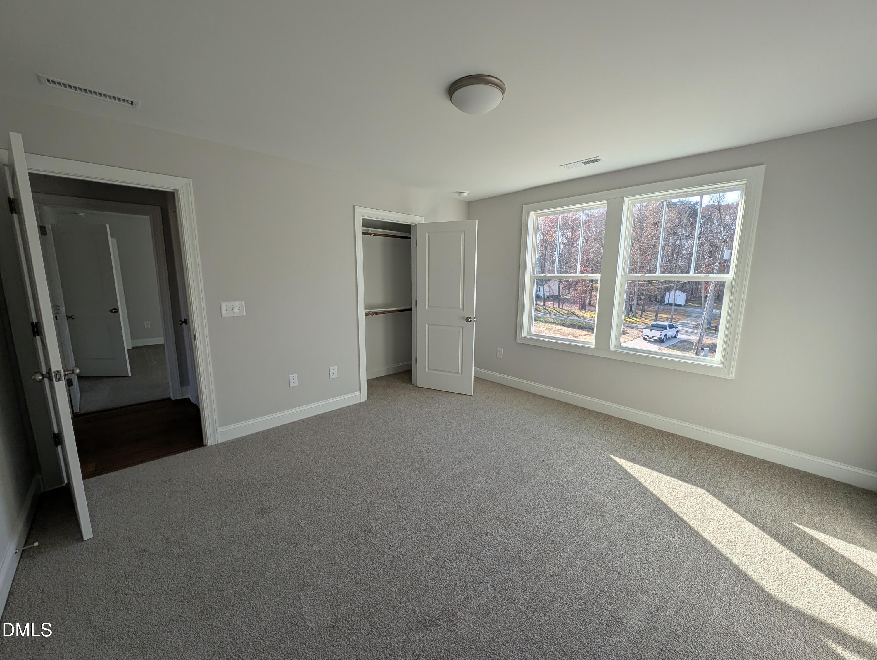 2818 John Lewis Road Burlington, NC 27217 - Photo 55 of 62 a view of an empty room with a window