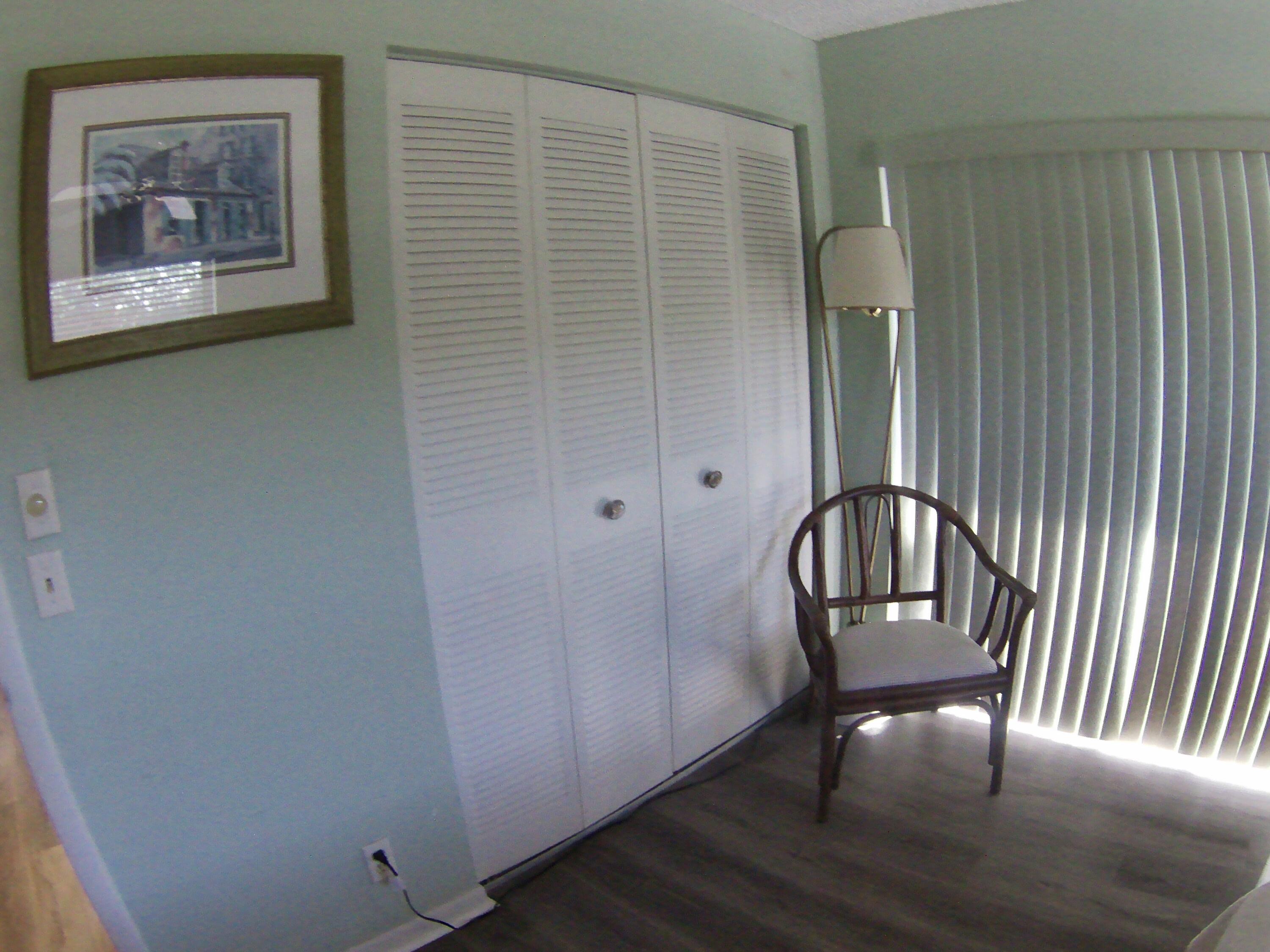 571 Capri L Delray Beach, FL 33484 - Photo 18 of 33 a view of a hallway with paintings on the wall