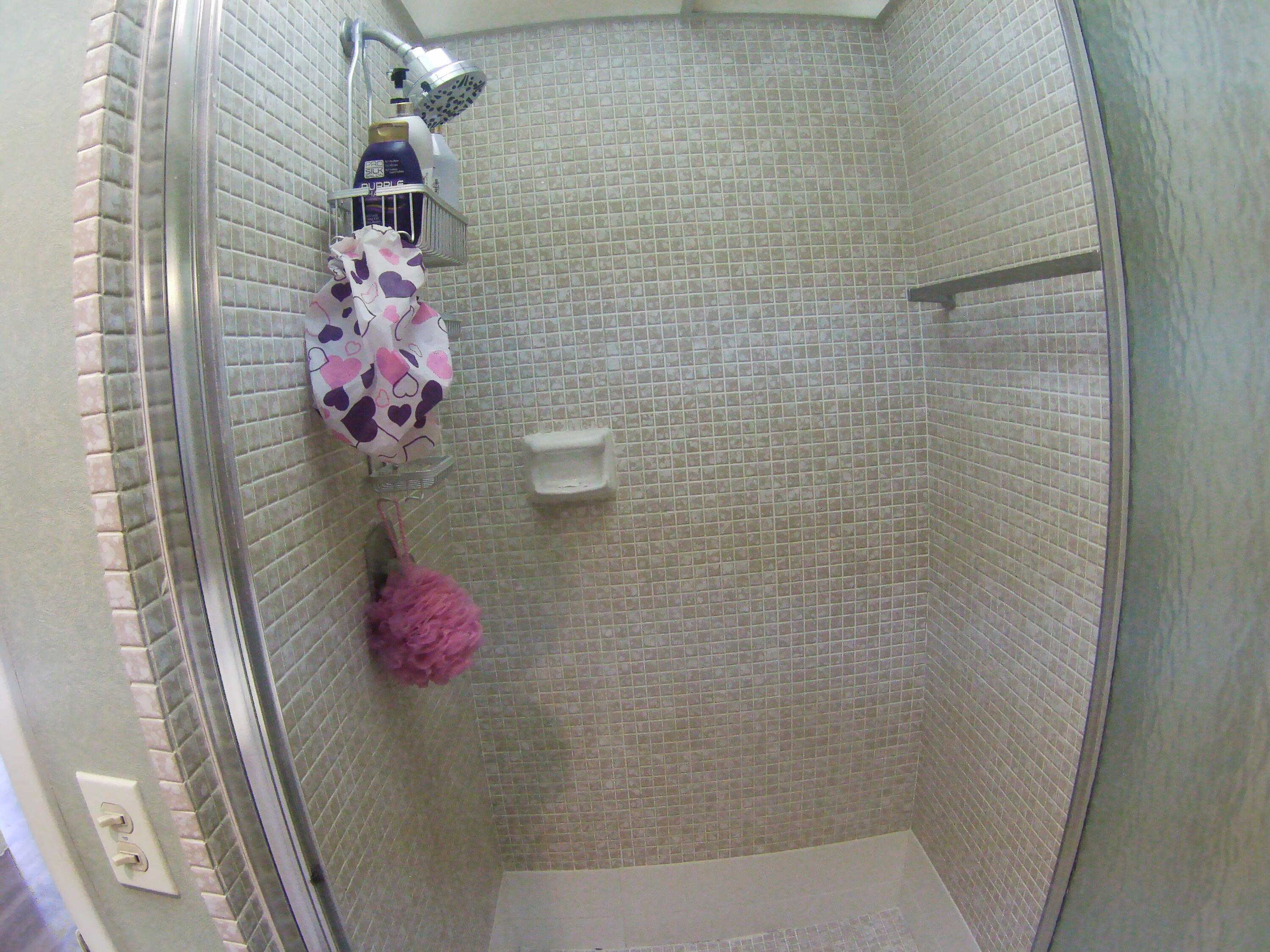 571 Capri L Delray Beach, FL 33484 - Photo 23 of 33 a bathroom with a shower