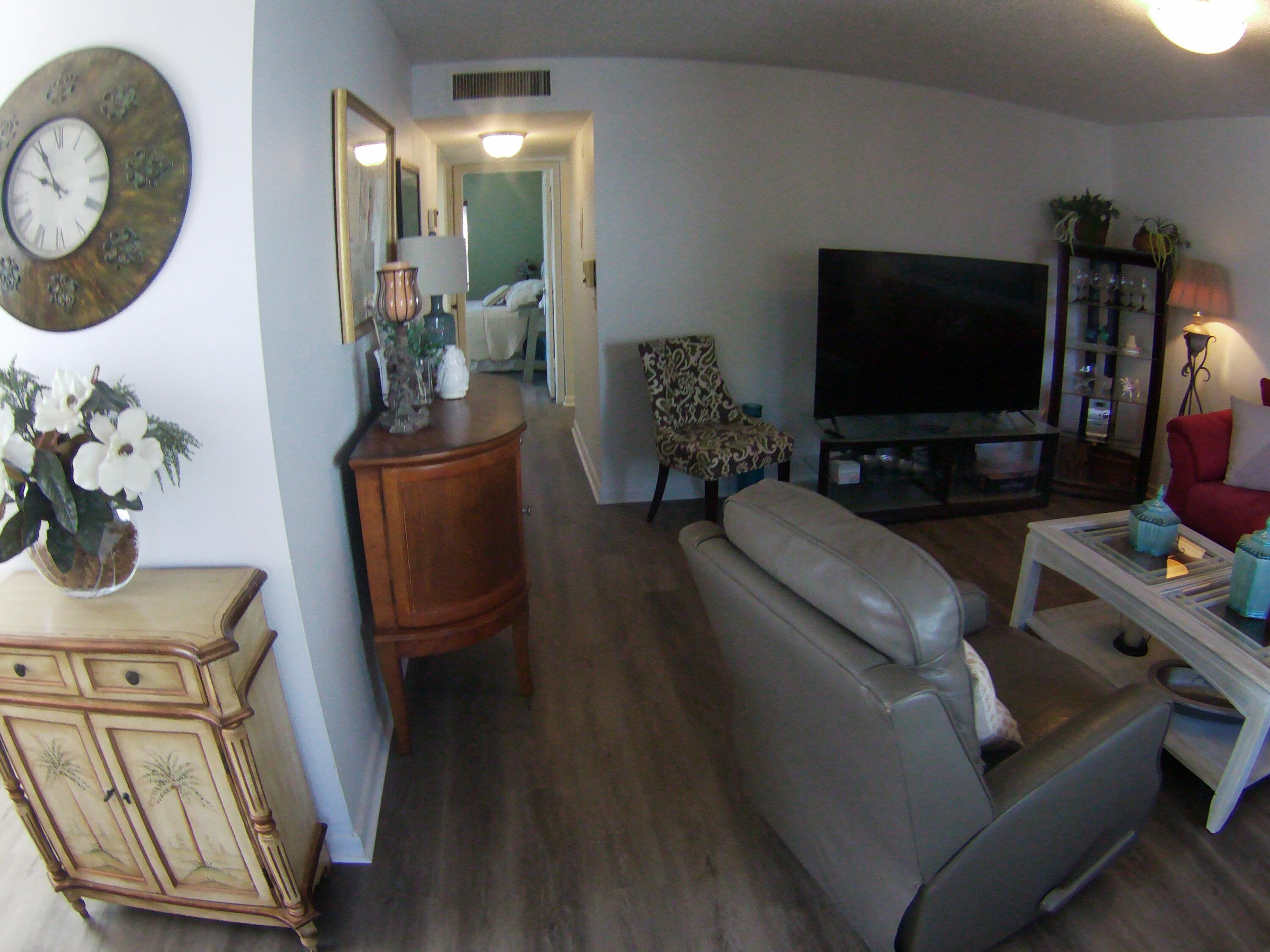 571 Capri L Delray Beach, FL 33484 - Photo 5 of 33 a living room with furniture and a flat screen tv