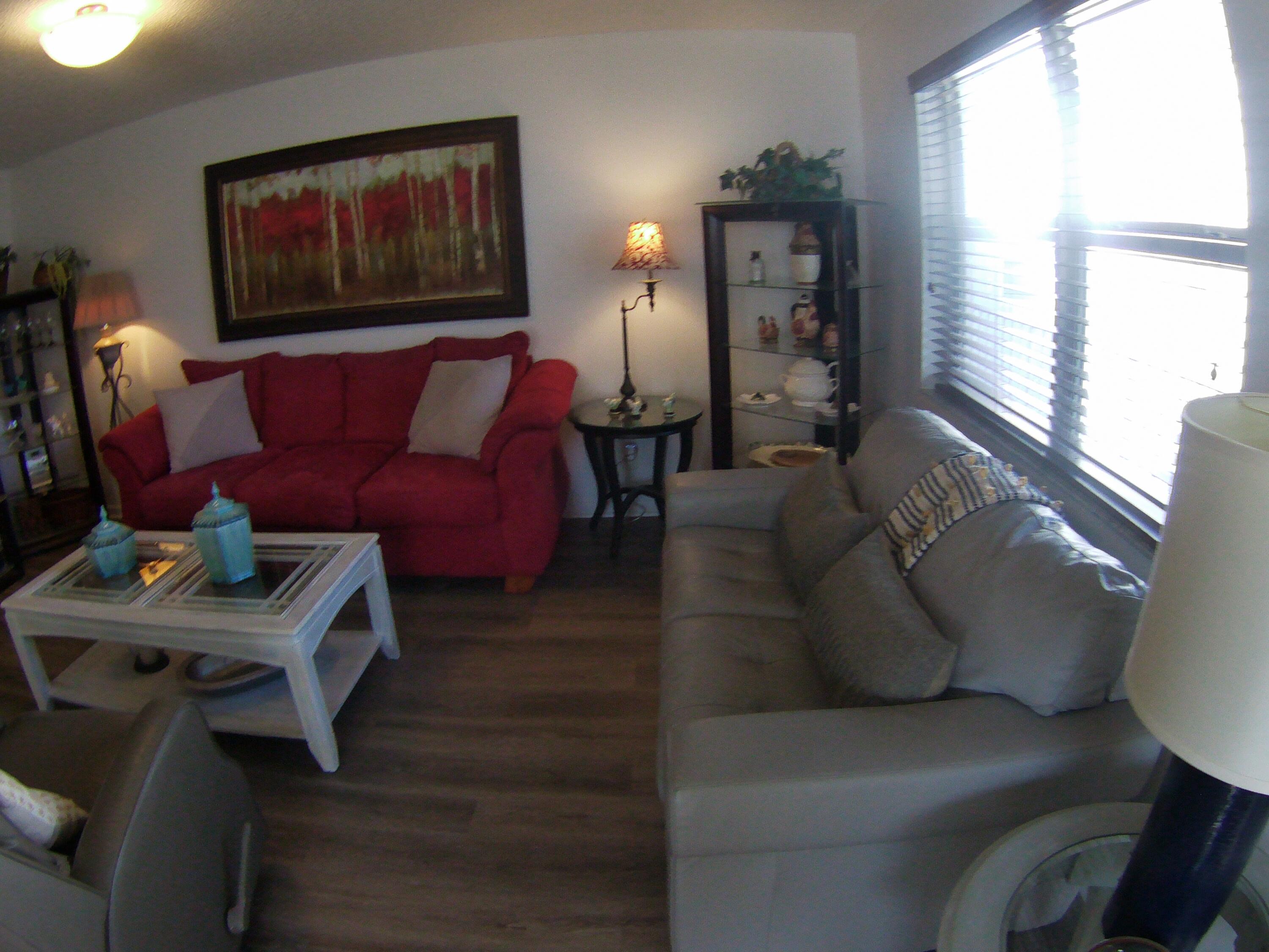 571 Capri L Delray Beach, FL 33484 - Photo 6 of 33 a living room with furniture and wooden floor