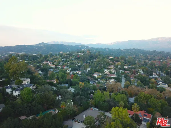 an aerial view of residential house and green space