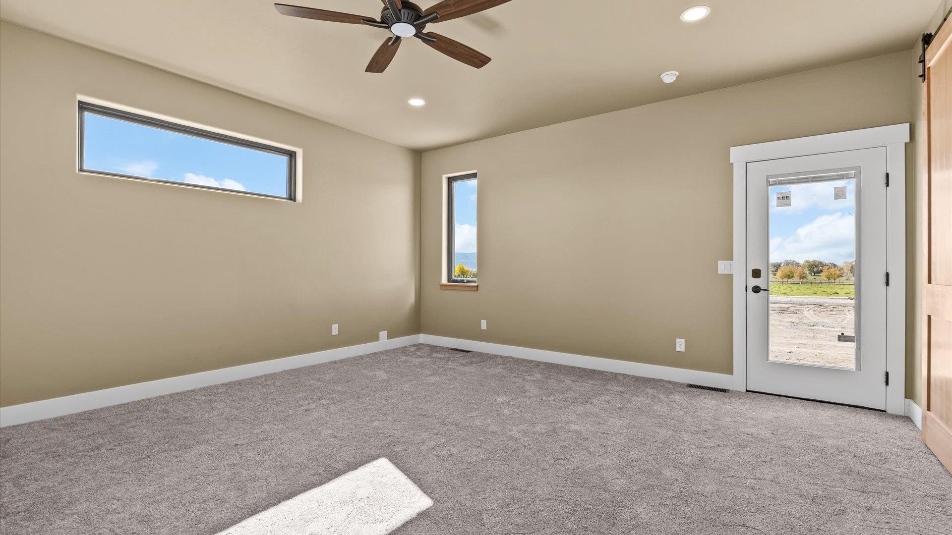 1193 22 1/2 Road Grand Junction, CO 81505 - Photo 11 of 28 a view of an empty room with window and cabinet