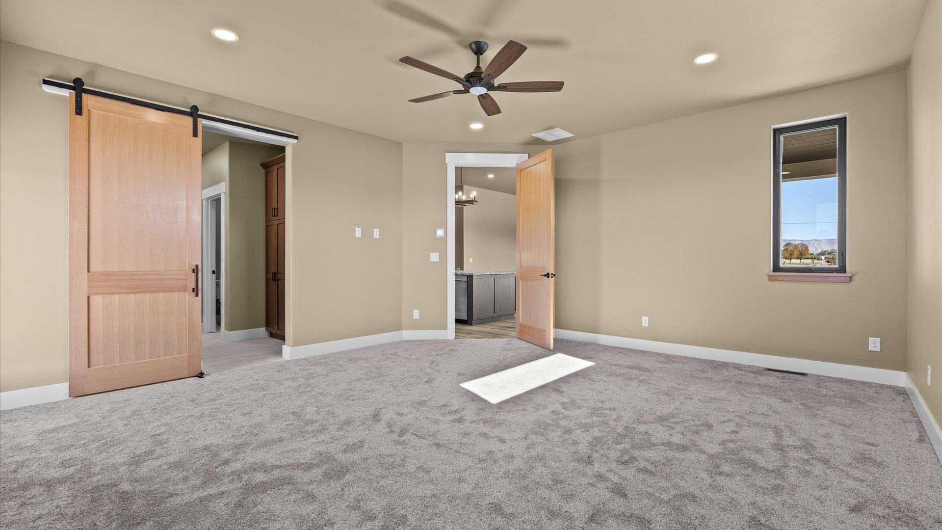 1193 22 1/2 Road Grand Junction, CO 81505 - Photo 12 of 28 an empty room with closet and a ceiling fan
