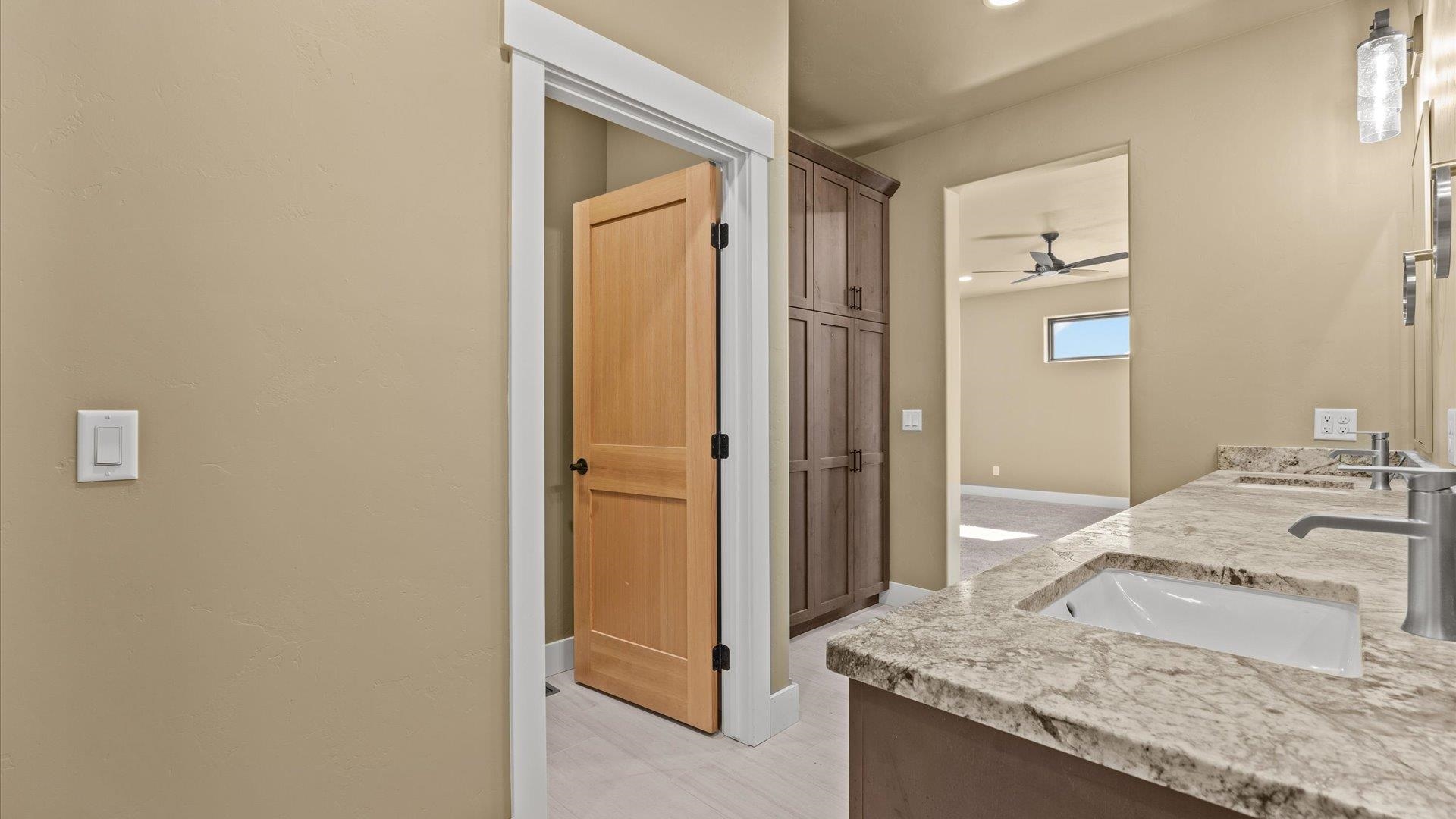 1193 22 1/2 Road Grand Junction, CO 81505 - Photo 14 of 28 a bathroom with a granite countertop sink and a mirror