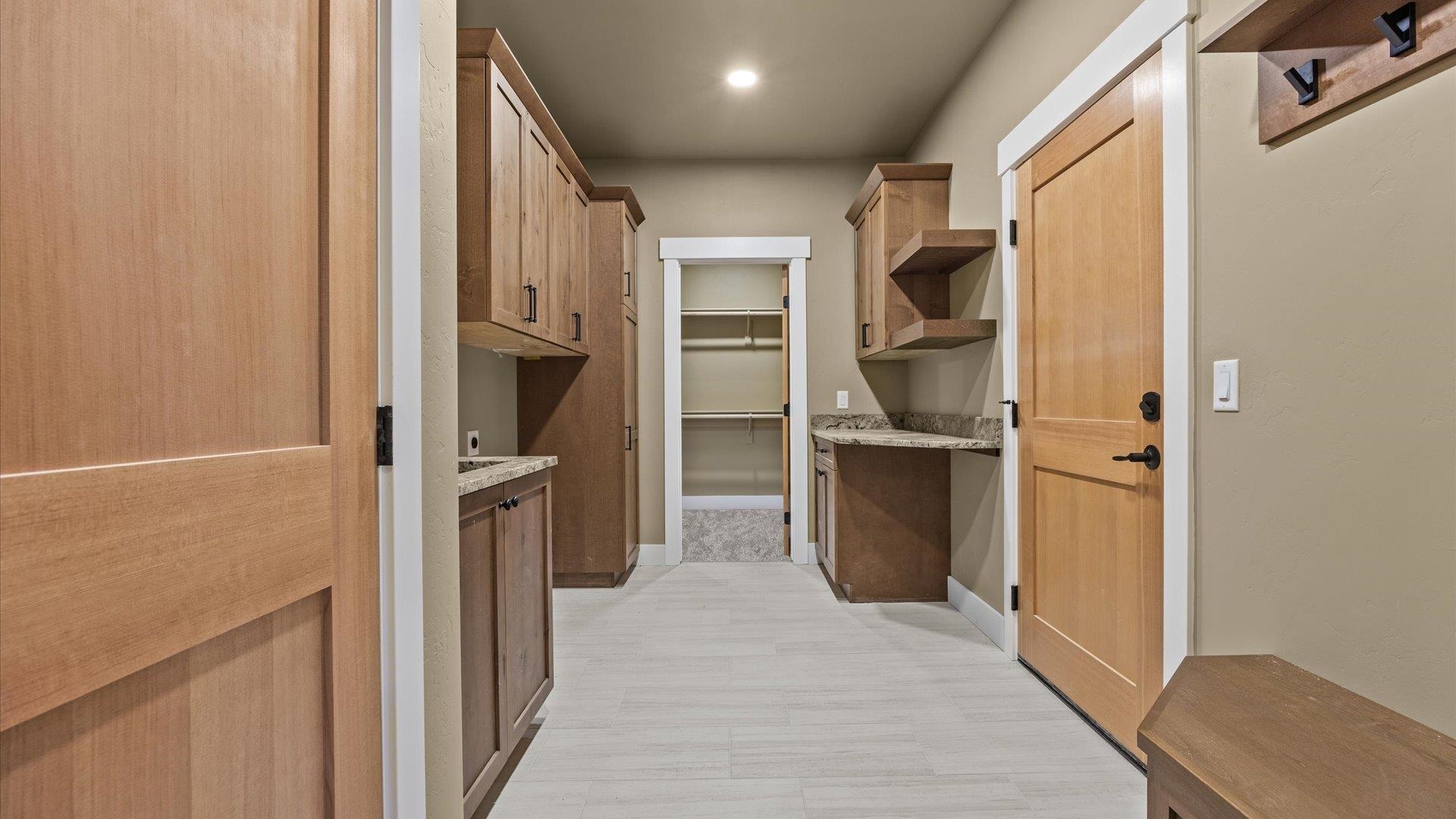 1193 22 1/2 Road Grand Junction, CO 81505 - Photo 17 of 28 a view of hallway with refrigerator and cabinet