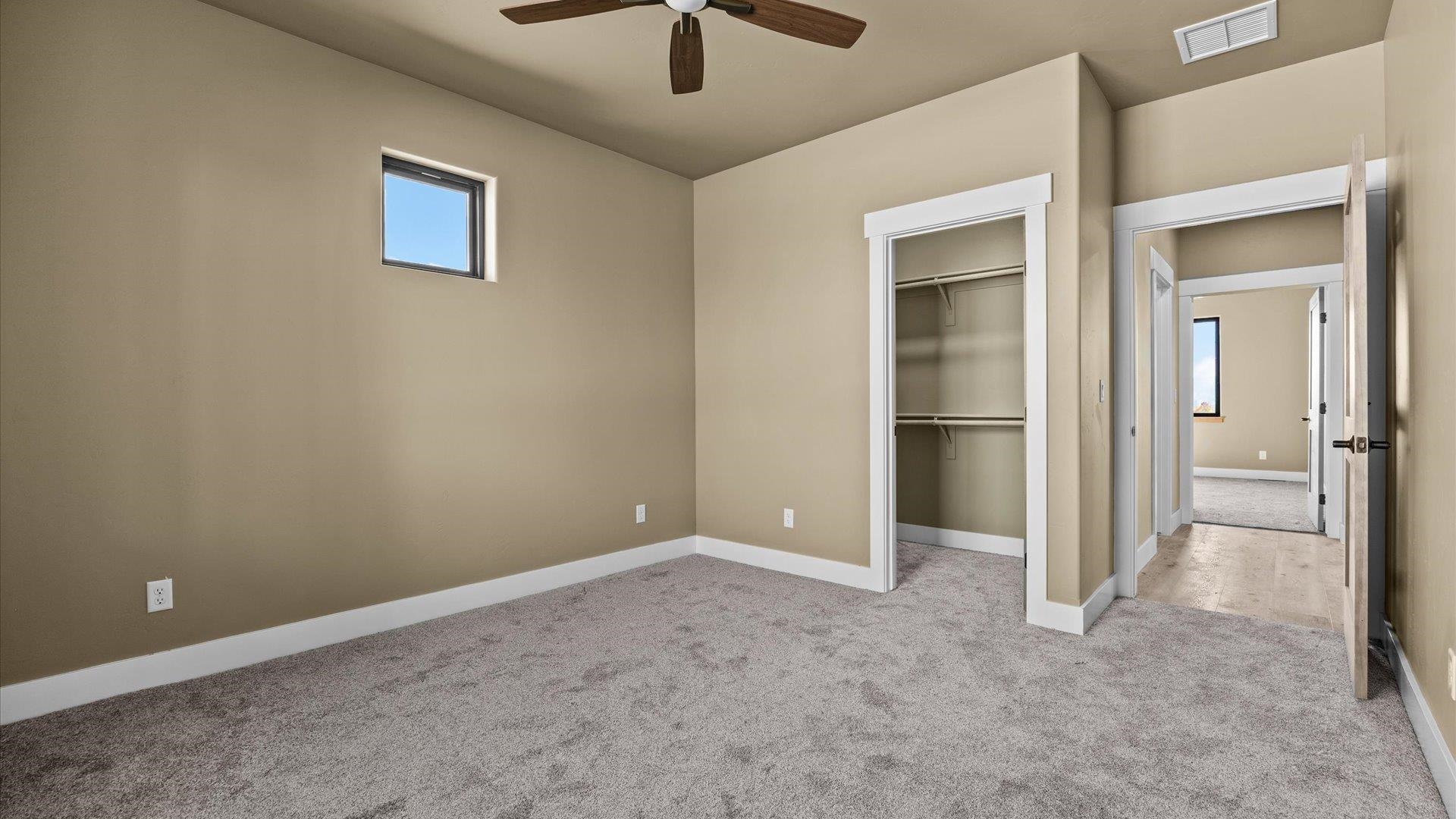 1193 22 1/2 Road Grand Junction, CO 81505 - Photo 19 of 28 an empty room and chandelier fan
