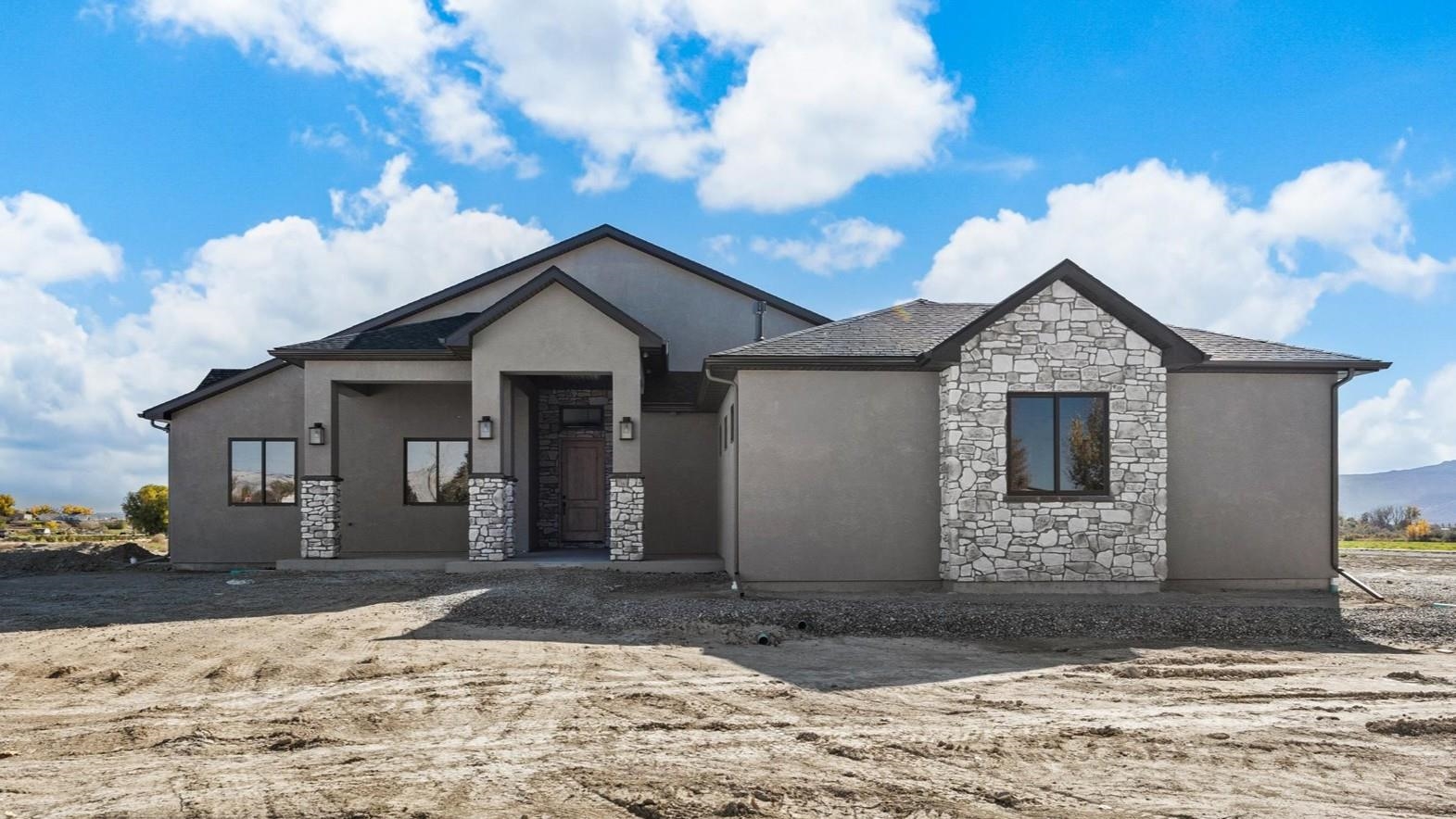 1193 22 1/2 Road Grand Junction, CO 81505 - Photo 2 of 28 a front view of a house with a yard