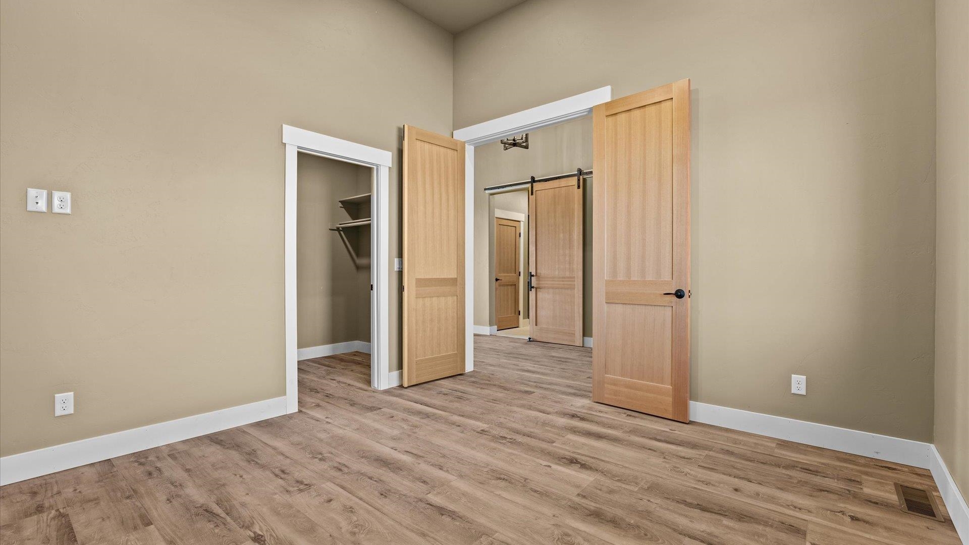 1193 22 1/2 Road Grand Junction, CO 81505 - Photo 23 of 28 a view of an empty room with wooden floor