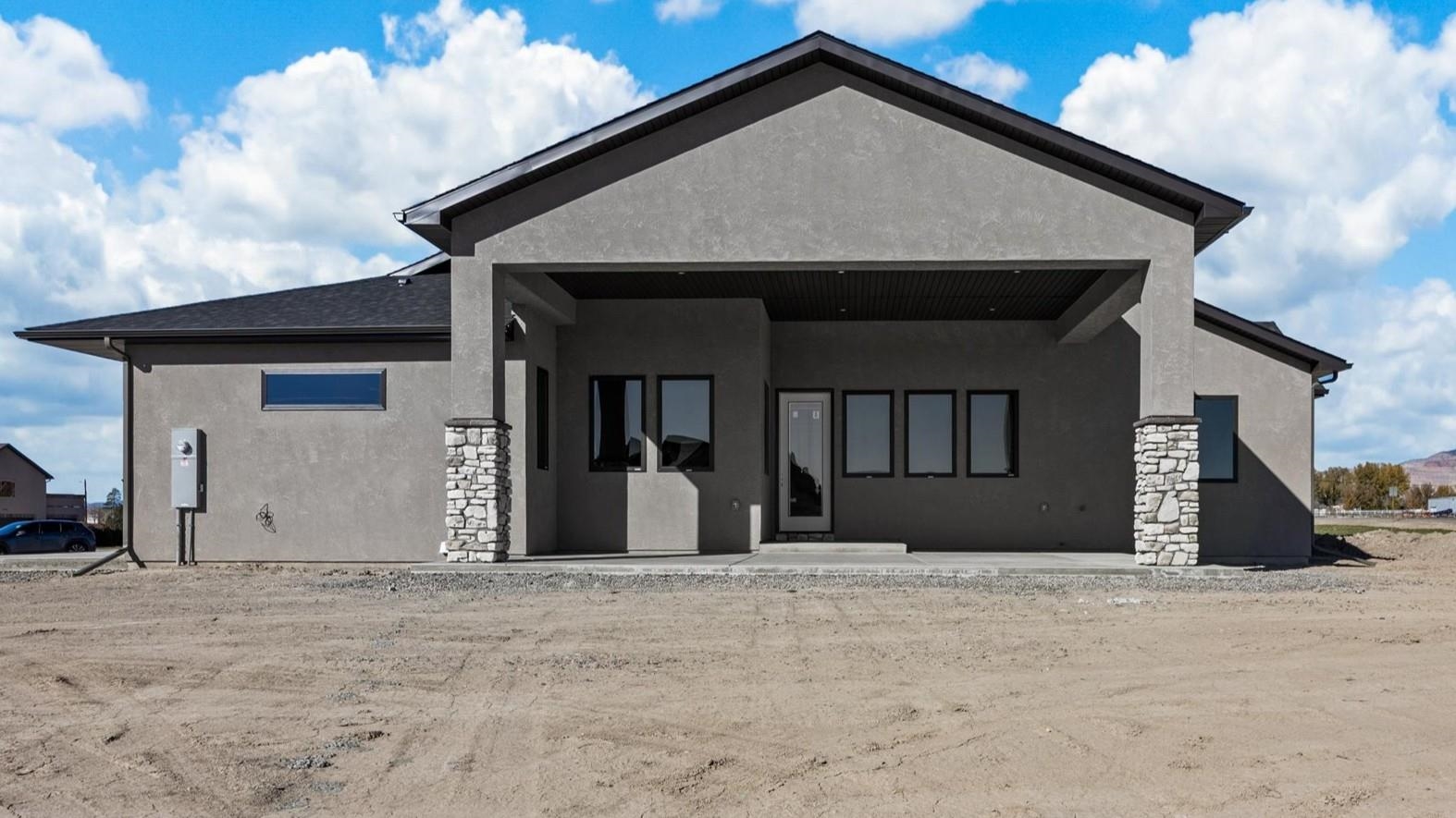 1193 22 1/2 Road Grand Junction, CO 81505 - Photo 25 of 28 a front view of a house with a yard
