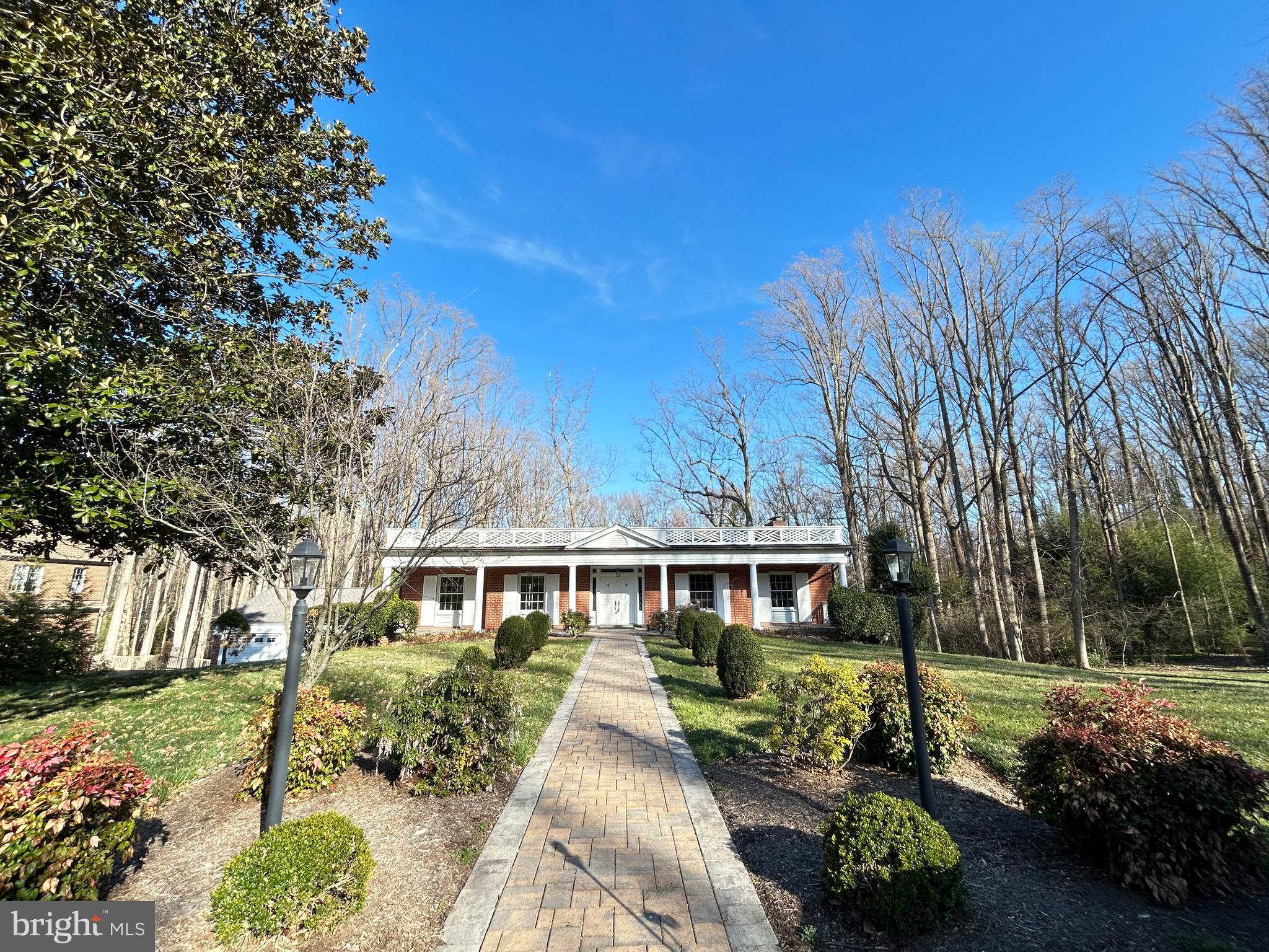 851 Canal Drive McLean, VA 22102 - Photo 1 of 50 a front view of a house with a yard