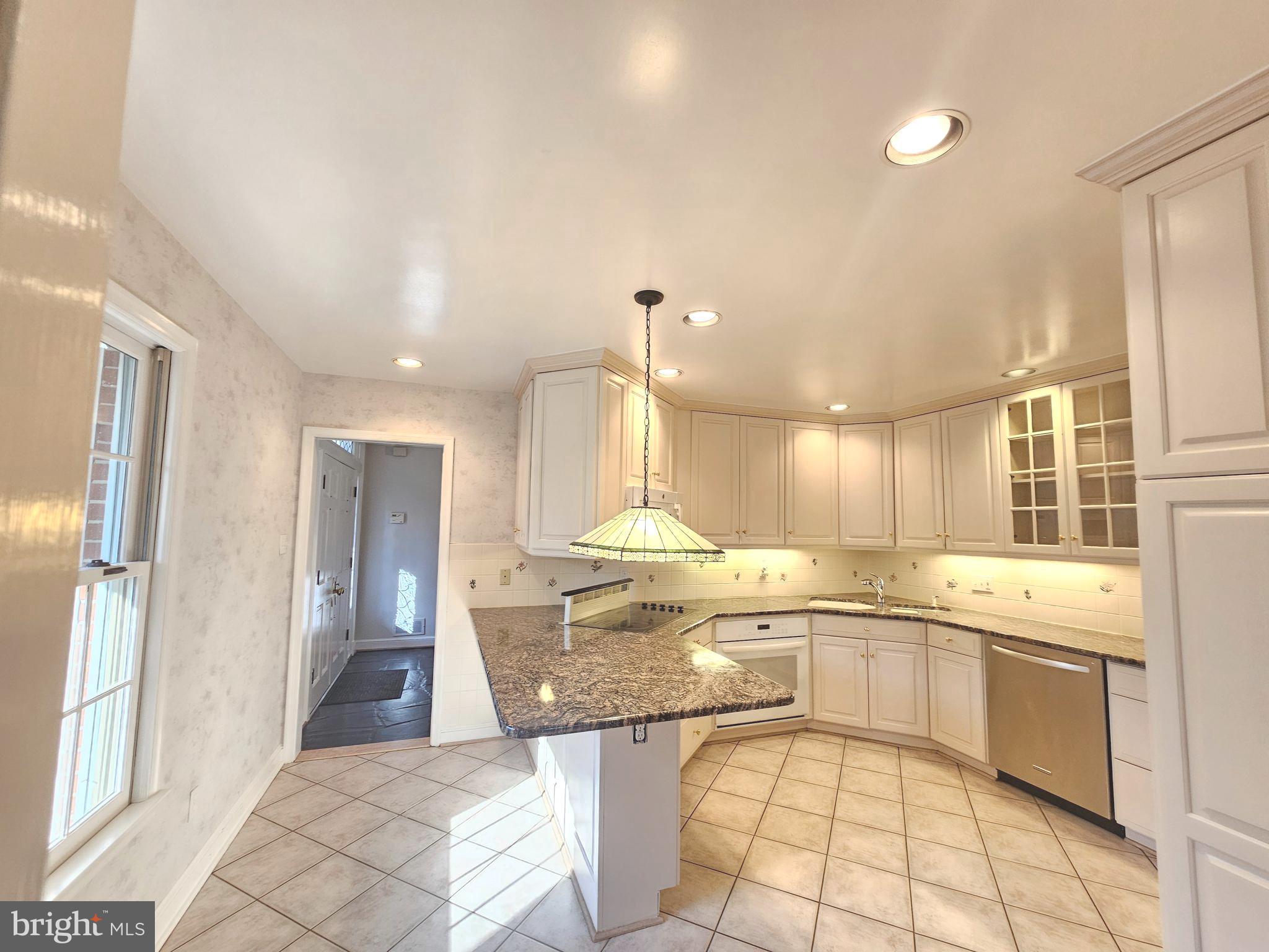 851 Canal Drive McLean, VA 22102 - Photo 13 of 50 a large kitchen with a lot of counter space and a sink