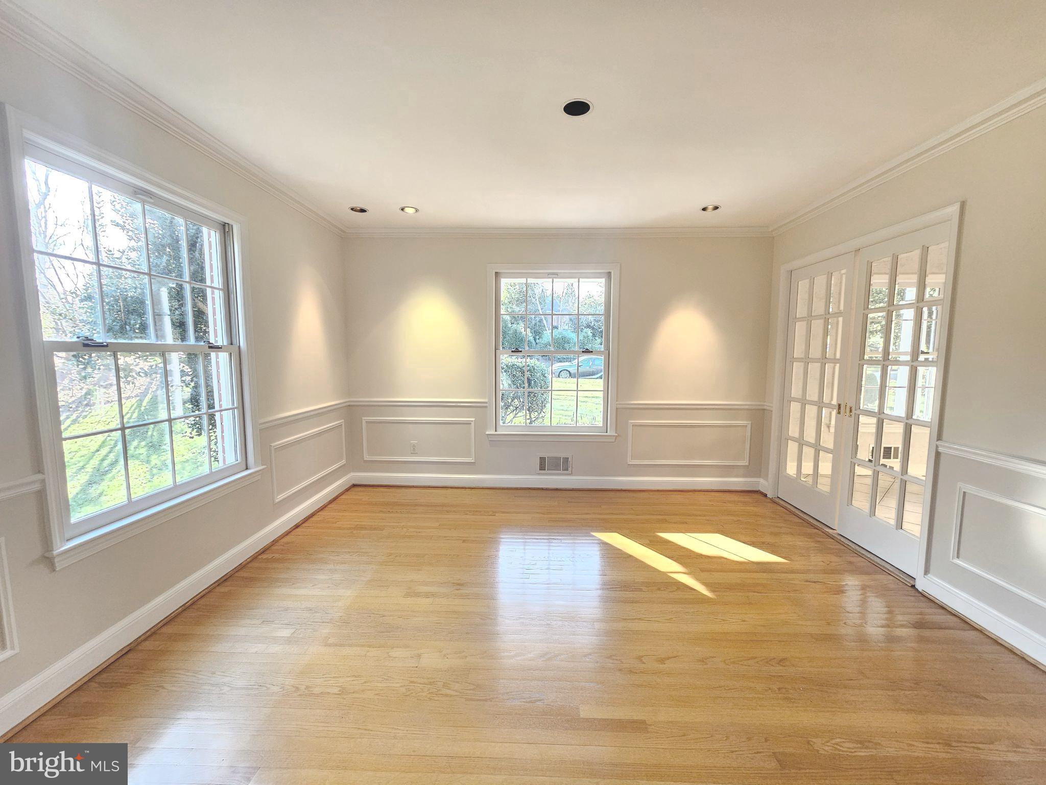 851 Canal Drive McLean, VA 22102 - Photo 19 of 50 a view of an empty room with wooden floor and a window