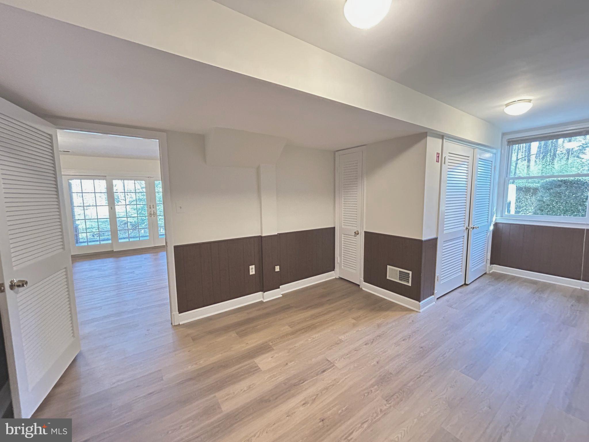 851 Canal Drive McLean, VA 22102 - Photo 28 of 50 an empty room with wooden floor and windows